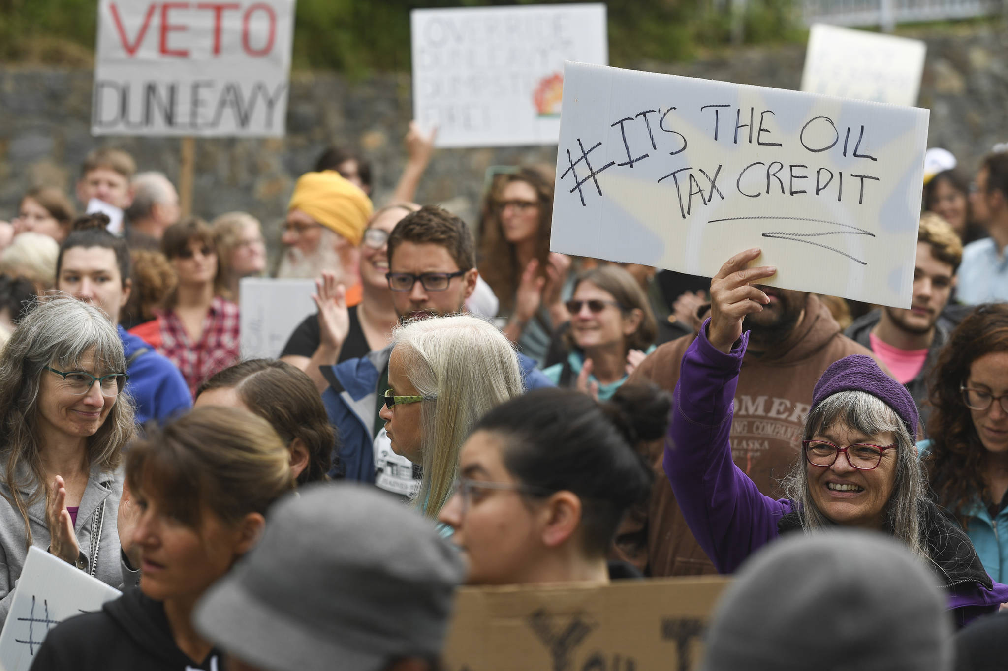 Over hundred people march from the Capitol to the Governor’s Mansion during a rally to protest budget vetoes by Gov. Mike Dunleavy on Friday, July 12, 2019. (Michael Penn | Juneau Empire)