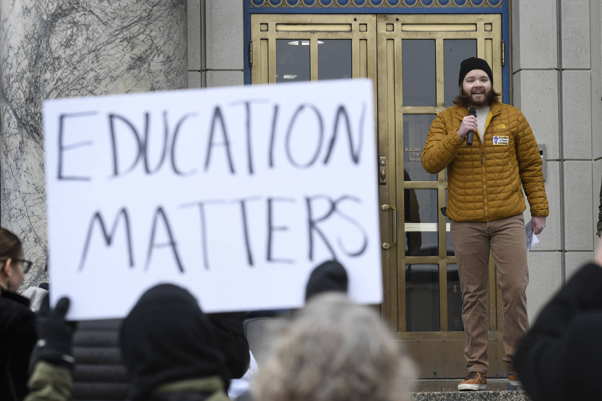 UAS Student Body President Nick Bursell speaks at a rally for funding the University of Alaska in front of the Capitol on Wednesday, Feb. 13, 2019. (Michael Penn | Juneau Empire)