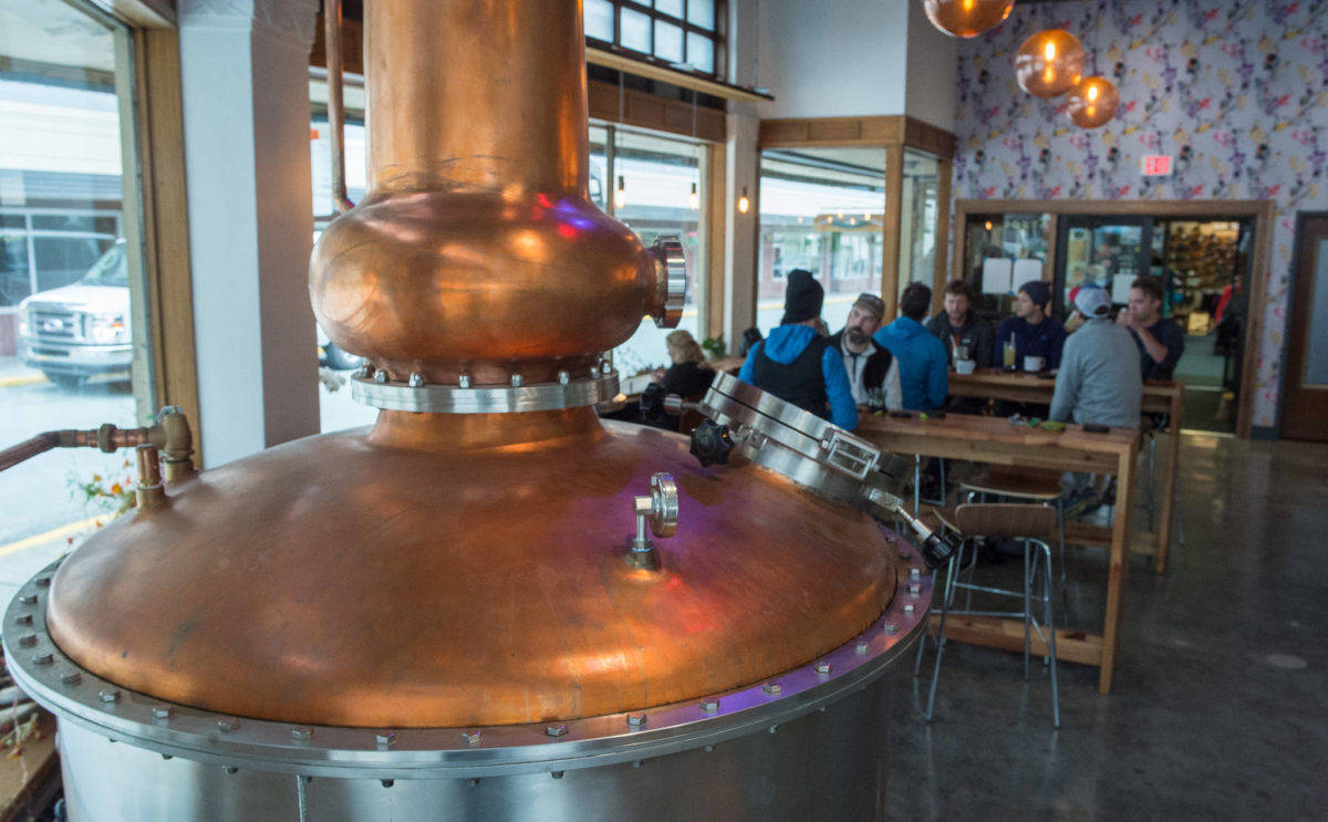 In this file photo from Sept. 14, 2017, a large still is a centerpiece in the tasting room at the Amalga Distillery at Franklin and Second Streets in downtown Juneau. (Michael Penn | Juneau Empire File)