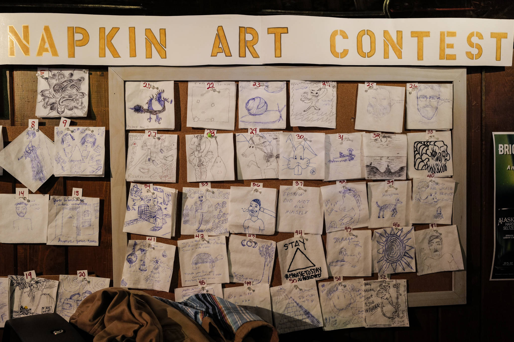 Napkin Art Contest contenders at the Triangle Bar during Gallery Walk on Friday, Dec. 6, 2019. (Michael Penn | Juneau Empire)