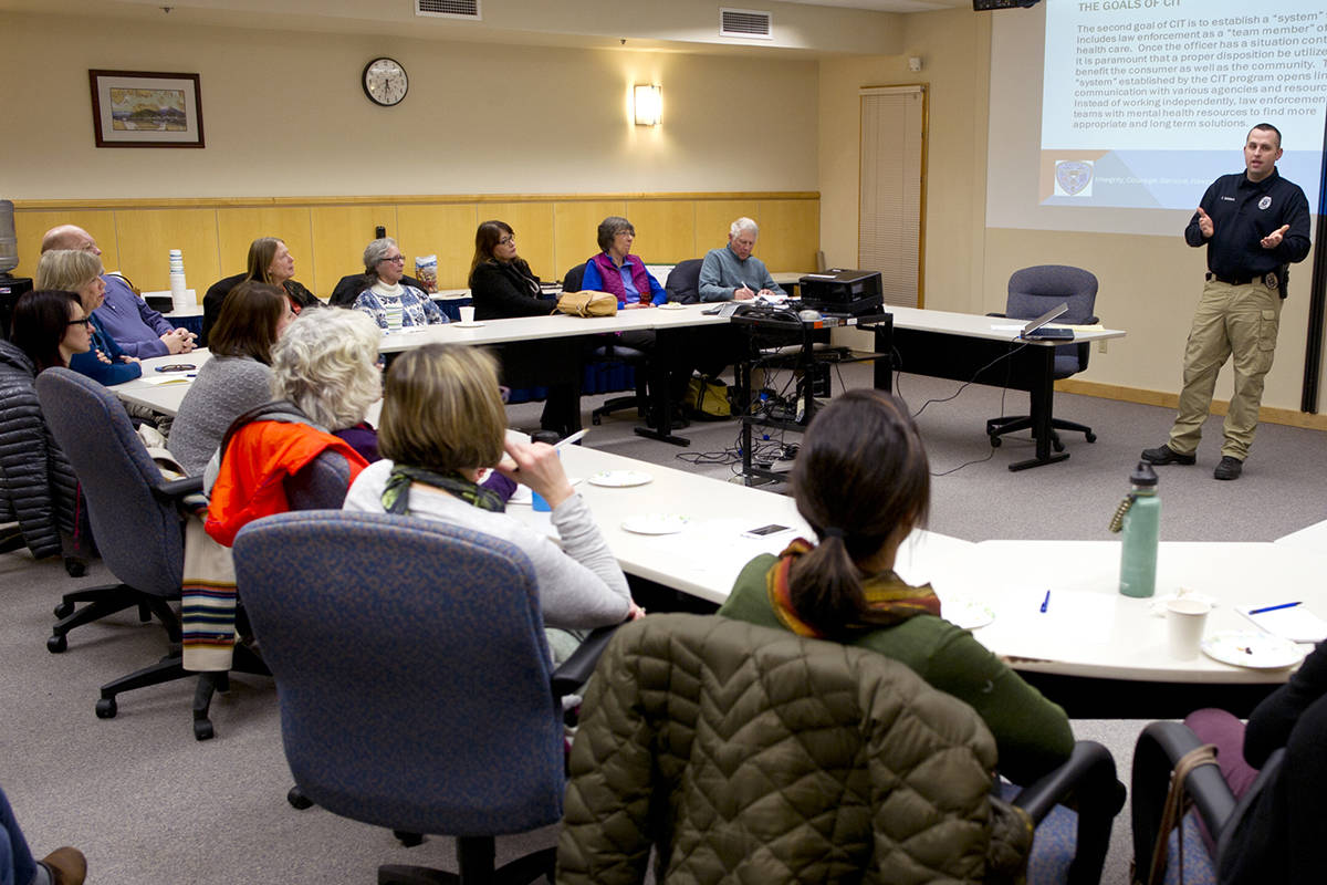 Juneau Police Department Detective Sterling Salisbury discusses how their department uses Crisis Intervention Team training to improve their response to individuals in mental health crisis at a public forum hosted by NAMI Juneau at Bartlett Regional Hospital on Tuesday, Jan. 10, 2017. (Michael Penn | Juneau Empire)