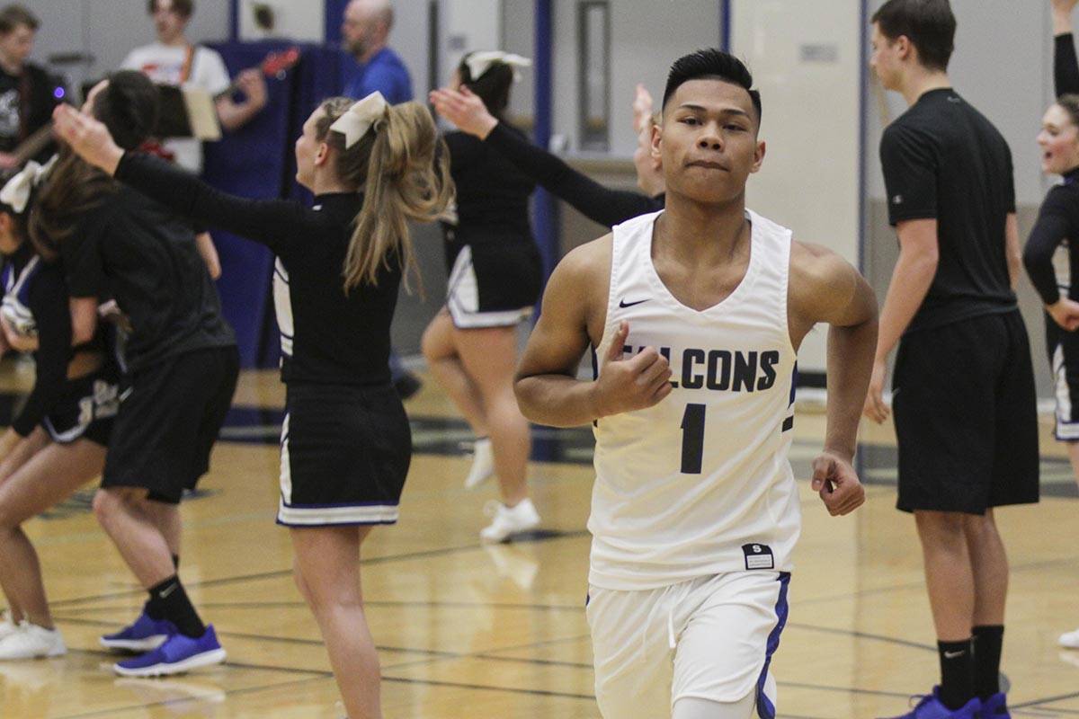 Michael S. Lockett | Juneau Empire                                 Brady Carandang jogs onto the court as Thunder Mountain High School prepares to play Wasilla High School on Friday.