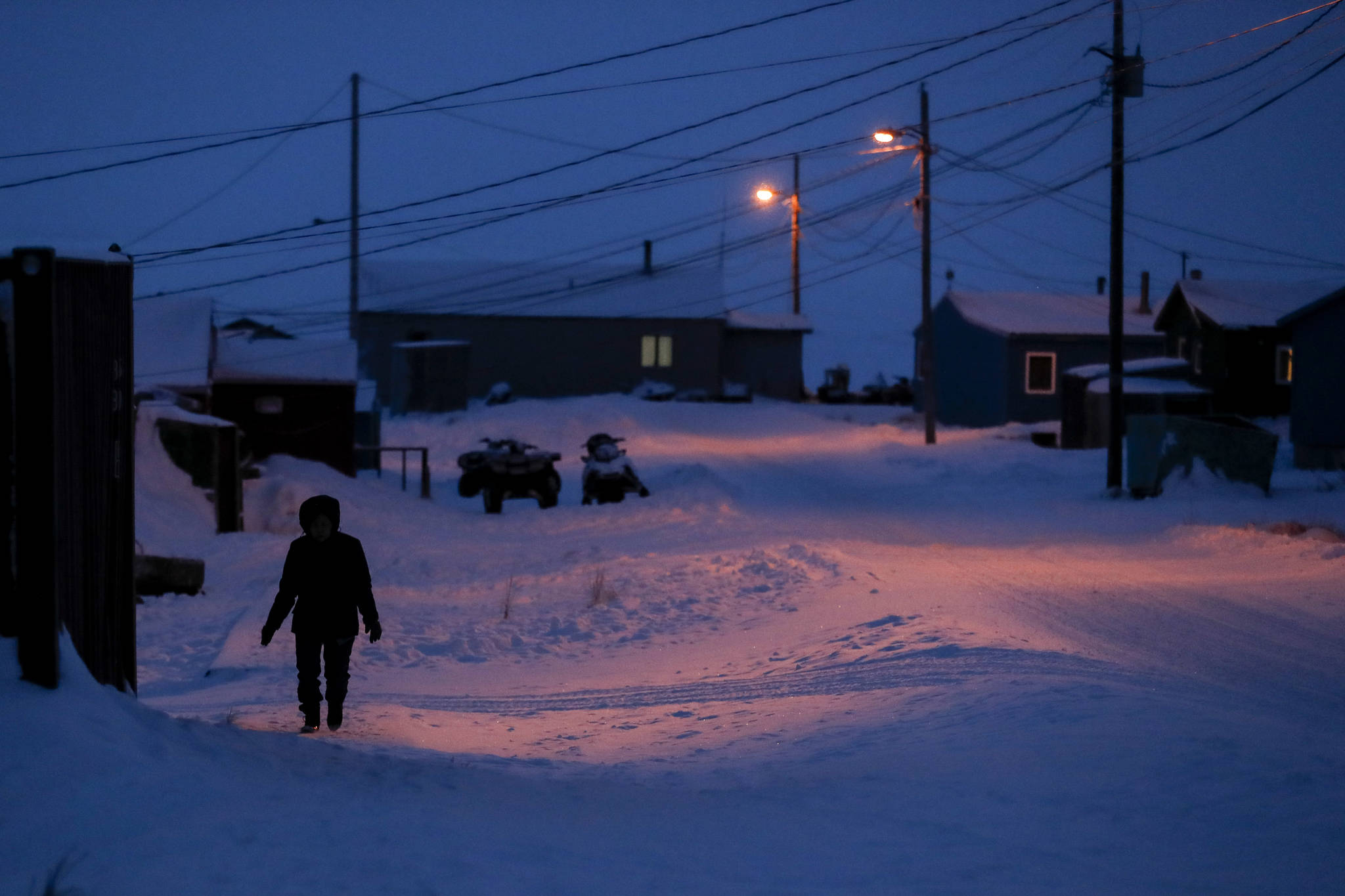 Associated Press                                In this January photo, a woman walks before dawn in Toksook Bay. Native American leaders are raising questions about how $8 billion in federal coronavirus relief tagged for tribes will be distributed, with some arguing that for-profit Alaska Native corporations shouldn’t get a share of the funding.