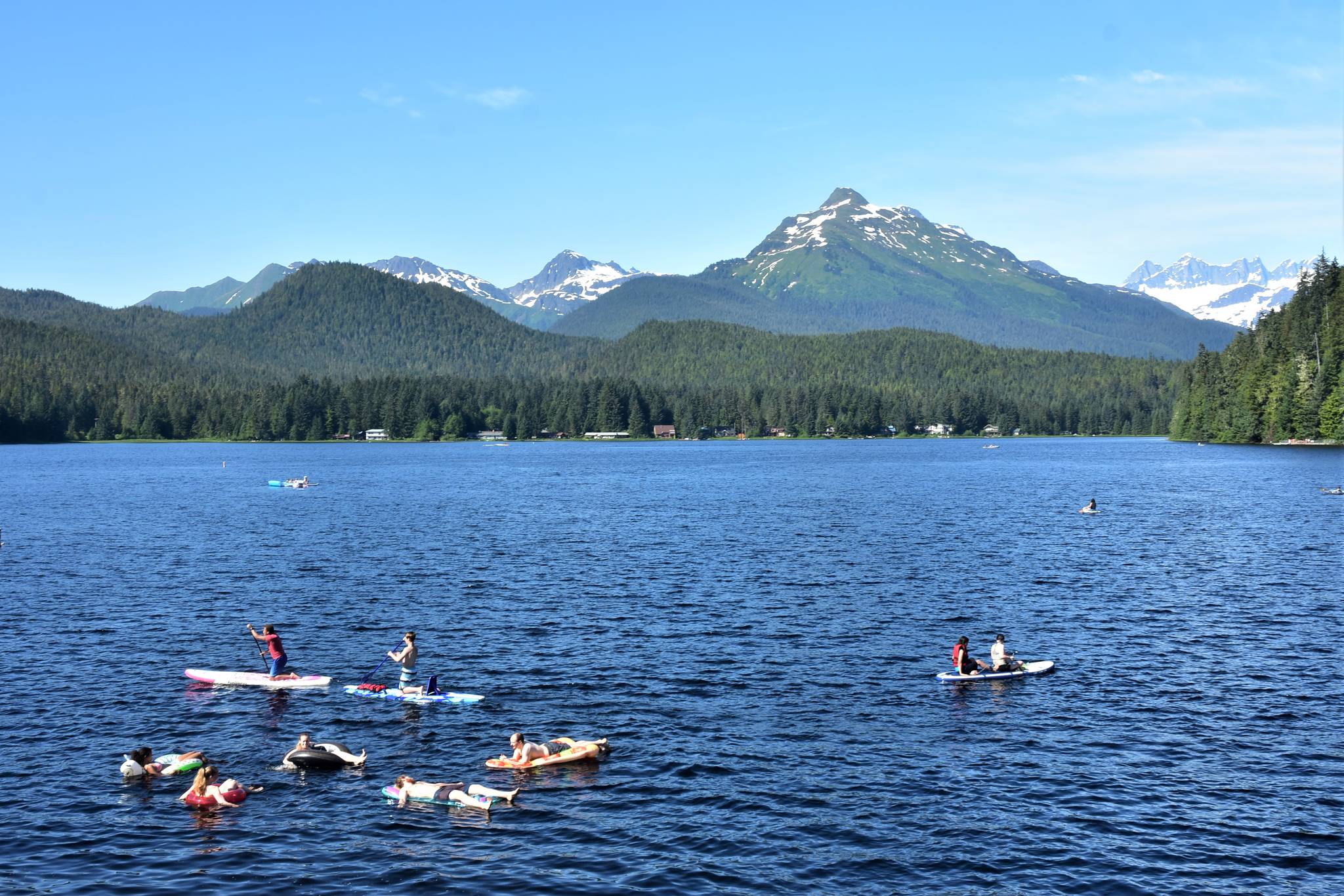 Juneauites enjoy the warm and sunny weather at Auke Lake on Thursday, July 2, 2020. Warm weather over the holiday weekend raised concerns about both COVID-19 spreading at gatherings, and fire danger from fireworks. (Peter Segall | Juneau Empire)