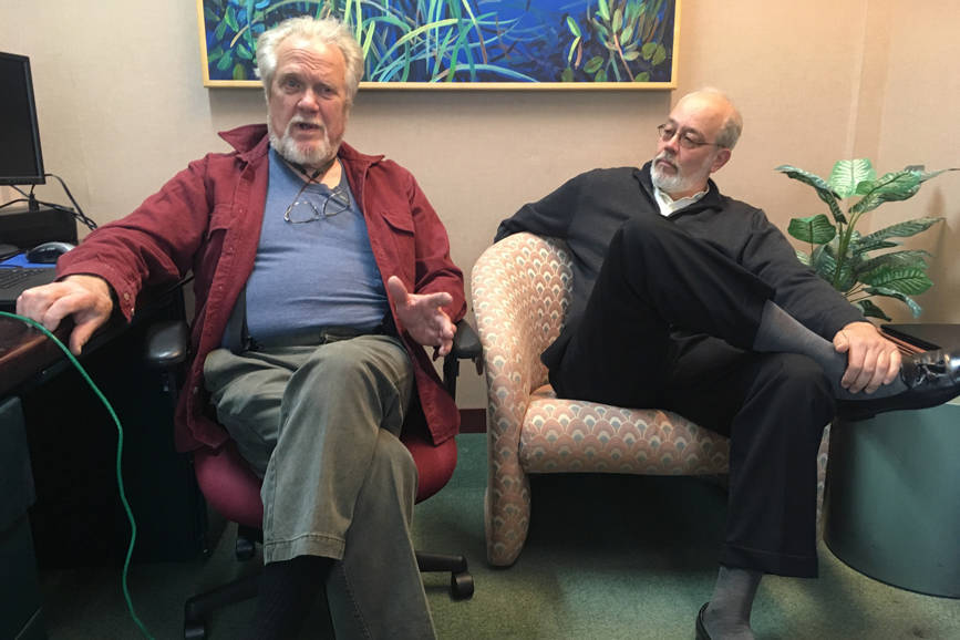 In this May 22, 2018 photo, Eric Forrer, left, and Joe Geldhof, right, discuss their lawsuit against the state of Alaska to stop a plan that calls for borrowing up to $1 billion from global bond markets to pay oil and gas tax credits owed by the state. (James Brooks / Juneau Empire File)