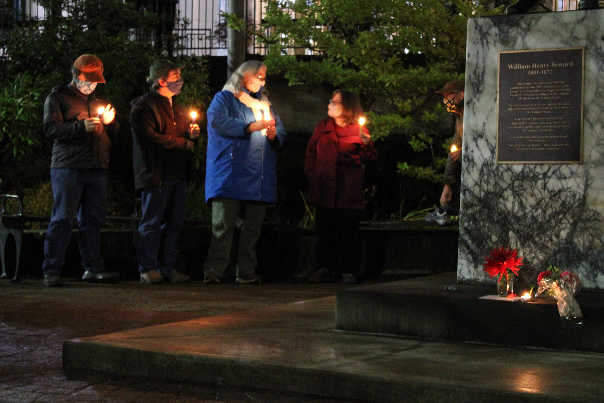 People gather for a candlelight vigil for the late Supreme Court Justice Ruth Bader Ginsburg near Dimond Courthouse on Saturday, Sept. 19. People shared remarks about some of Ginsburg’s most famous decisions during the event. Some expressed hopes her seat would not be filled until after Election Day. (Ben Hohenstatt / Juneau Empire)