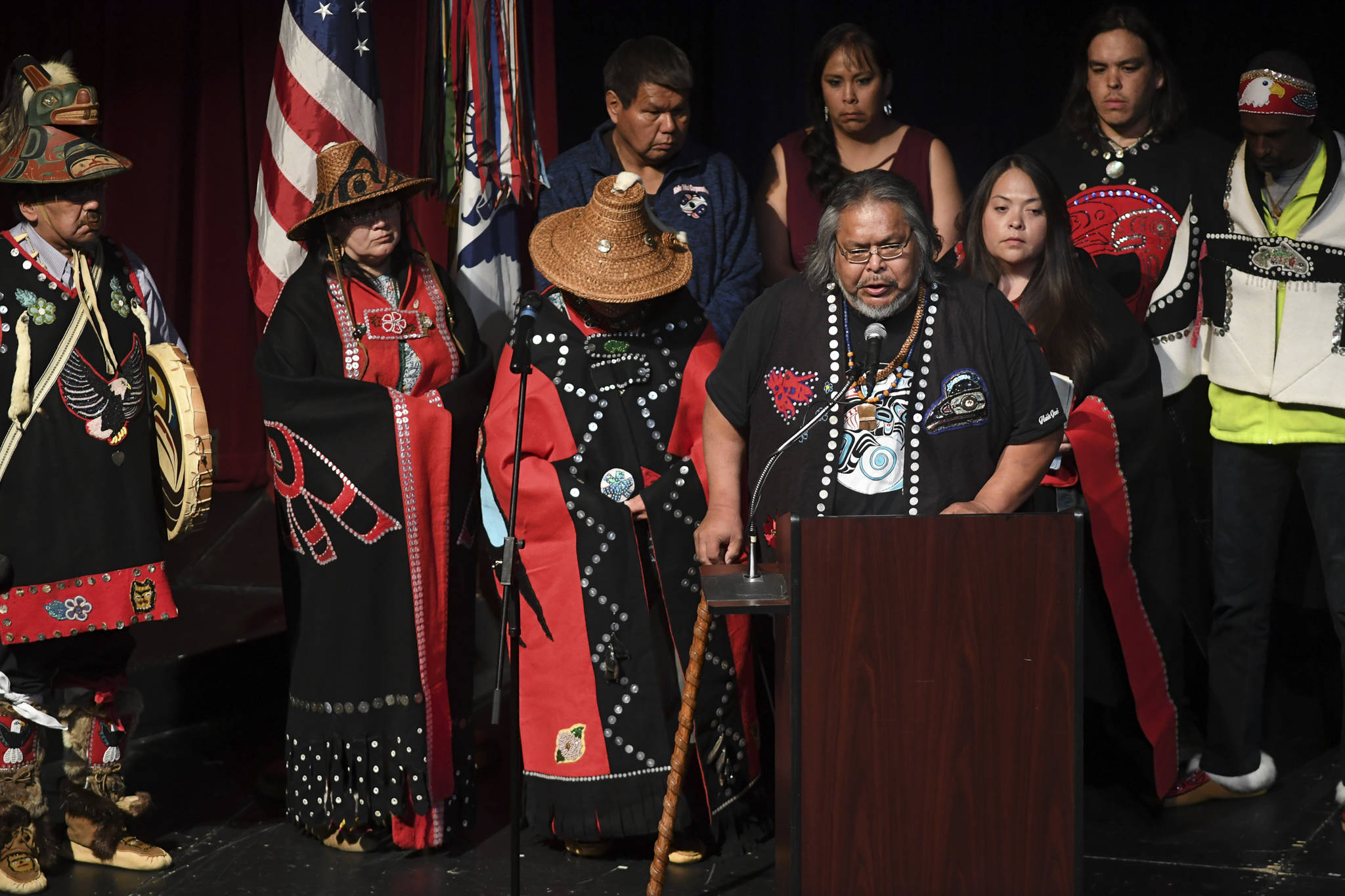 Joel Jackson speaks for members of Kake during memorial service for the Guardian Flight crew held at Juneau-Douglas High School: Yadaa.at Kalé on Friday, June 7, 2019. (Michael Penn / Juneau Empire File)