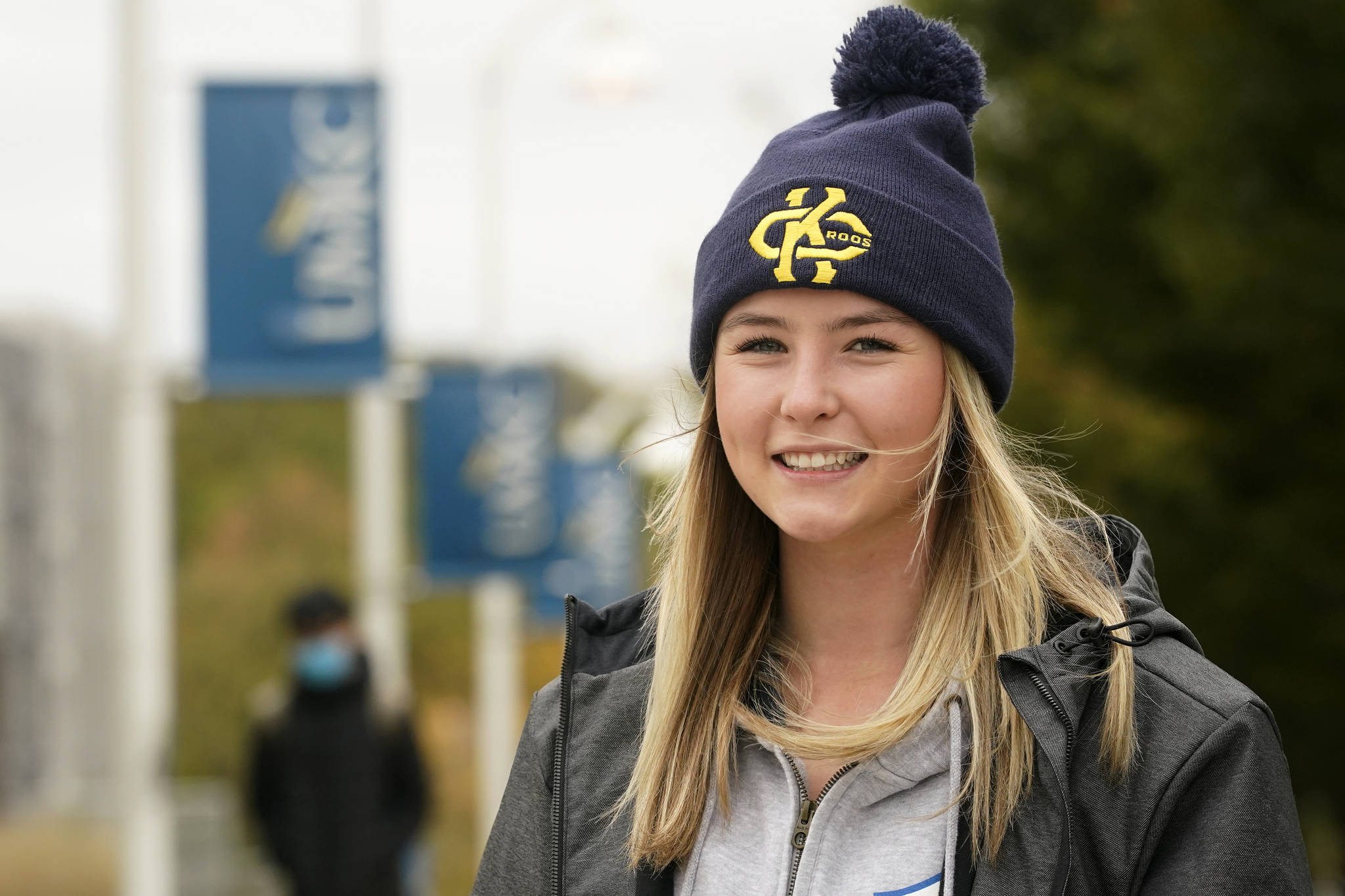 Madison Zurmuehlen poses for a photo on the University of Missouri-Kansas City campus in Kansas City, Mo., Friday, Oct. 23, 2020. Amid pandemic restrictions aimed at keeping students safe and healthy, colleges are scrambling to help them adjust. Zurmuehlen said daily practices, with masks, are “the one thing I look forward to,” so it was tough when campus sports were canceled for two weeks after an outbreak among student athletes and staff. (AP Photo / Orlin Wagner)