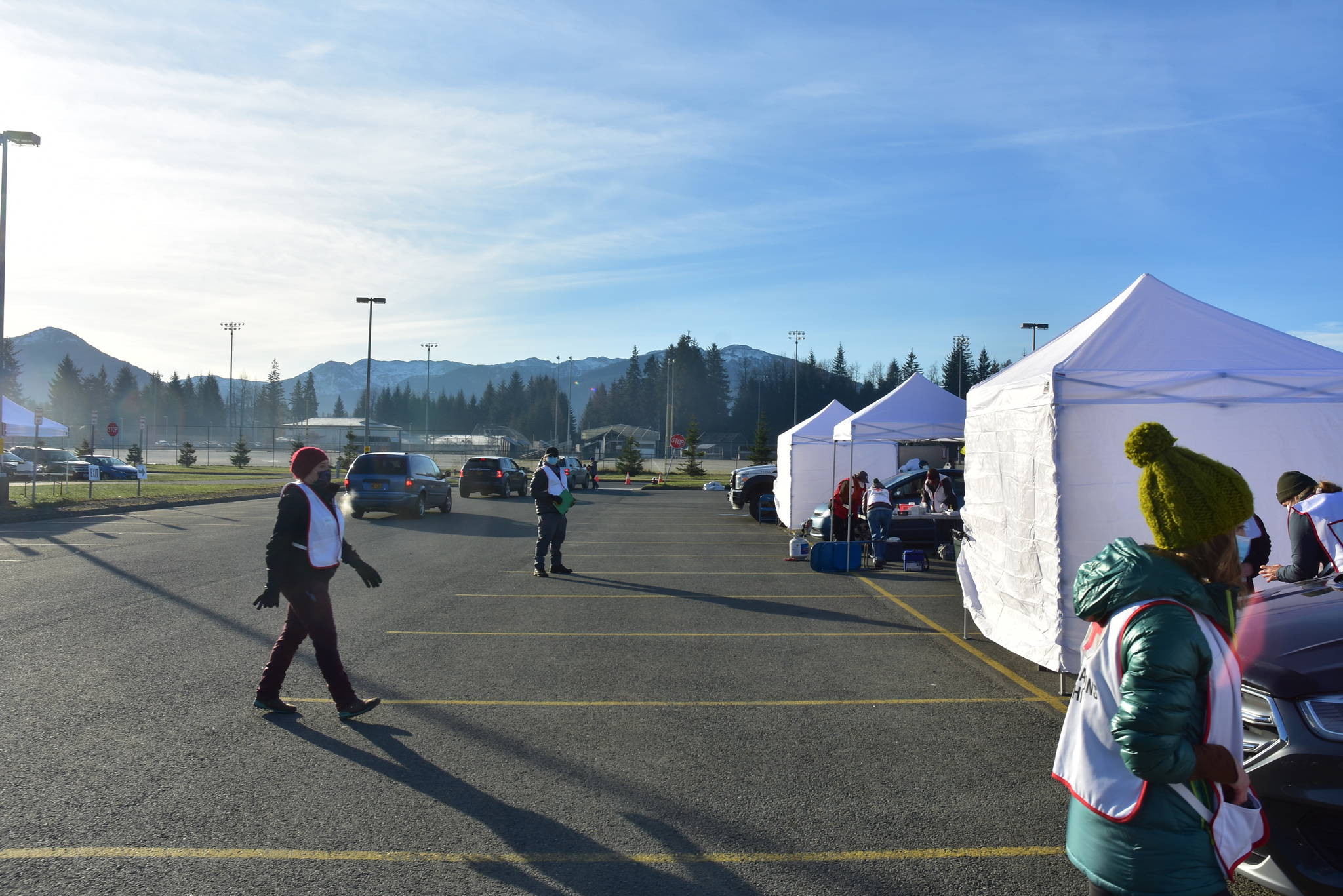 Health workers during a mass vaccination event for influzena at Thunder Mountain High School on Saturday, Oct. 24, 2020. The flu vaccine event served as a practice run for COVID-19 vaccine distribution, according to health officials. Such distribution requires coordination between multiple state and local agencies. (Peter Segall / Juneau Empire file)