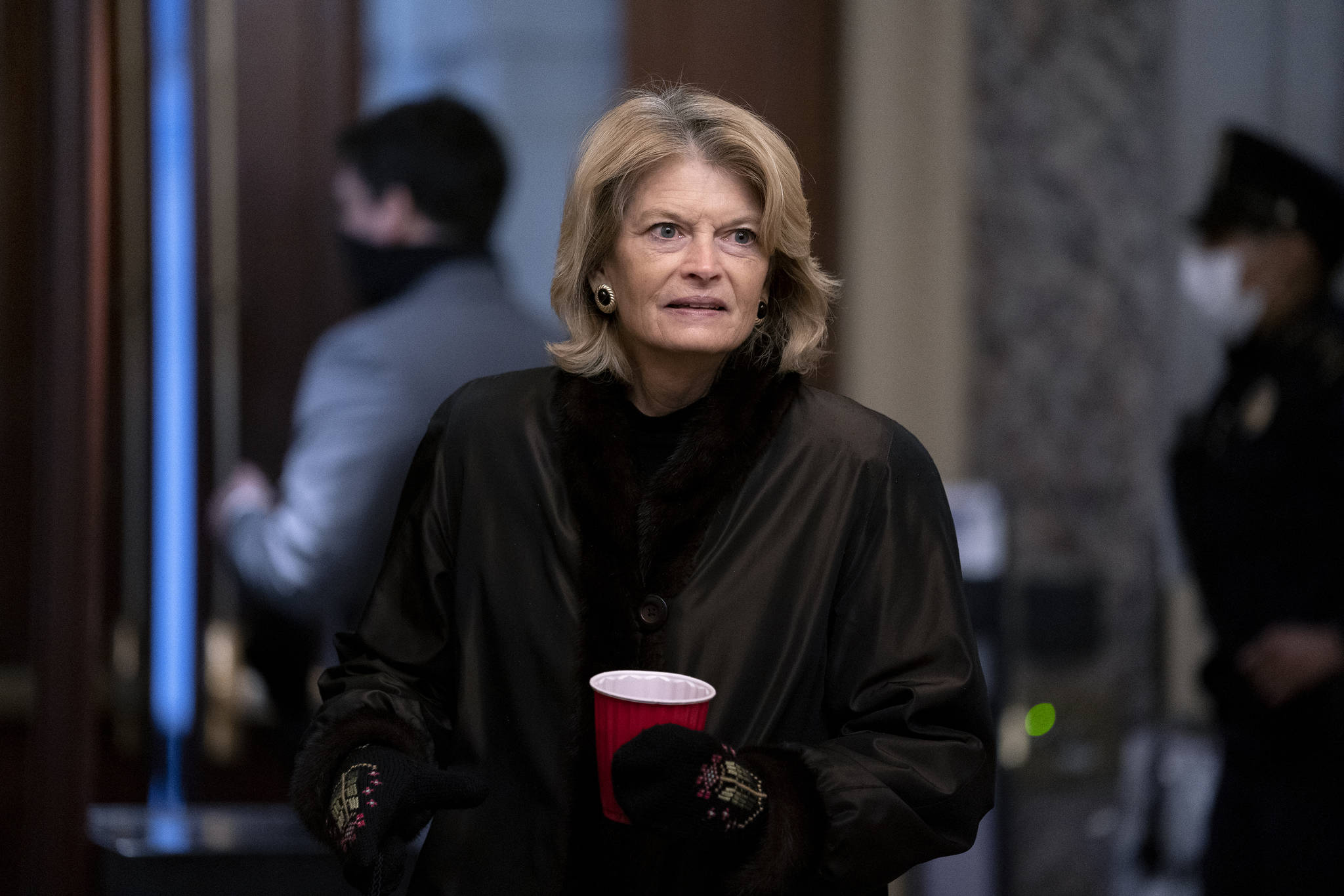 Sen. Lisa Murkowski, R-Alaska, arrives at the start of the fifth day of the second impeachment trial of former President Trump, Saturday, Feb. 13, 2021 at the Capitol in Washington. (Stefani Reynolds / Pool via AP)