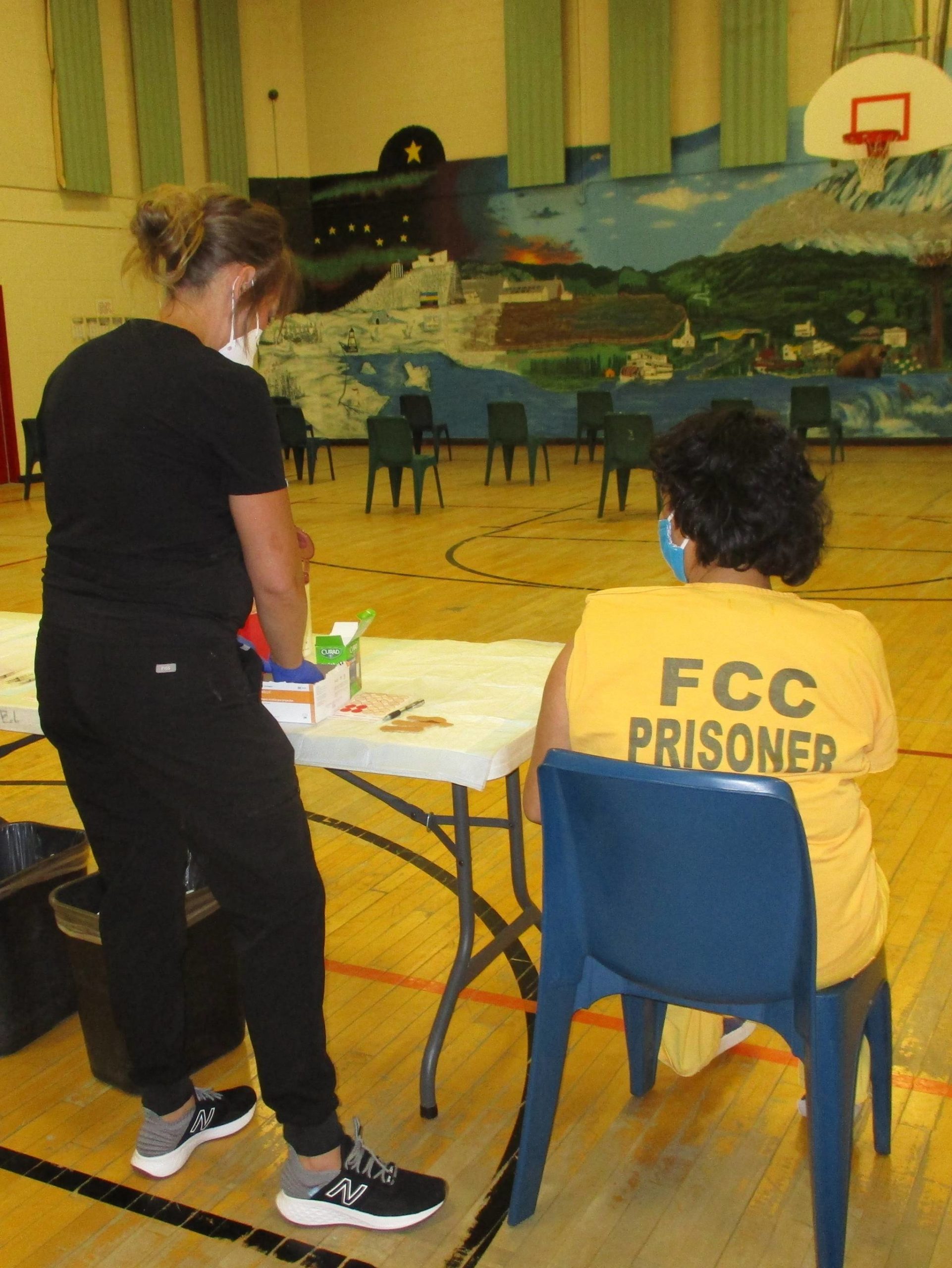 A Department of Corrections nurse vaccinates a Fairbanks Correctional Center inmate. The DOC eased restrictions on March 15, 2021, to allow attorneys to visit fully vaccinated inmates at DOC facilities. (Courtesy photo / DOC)