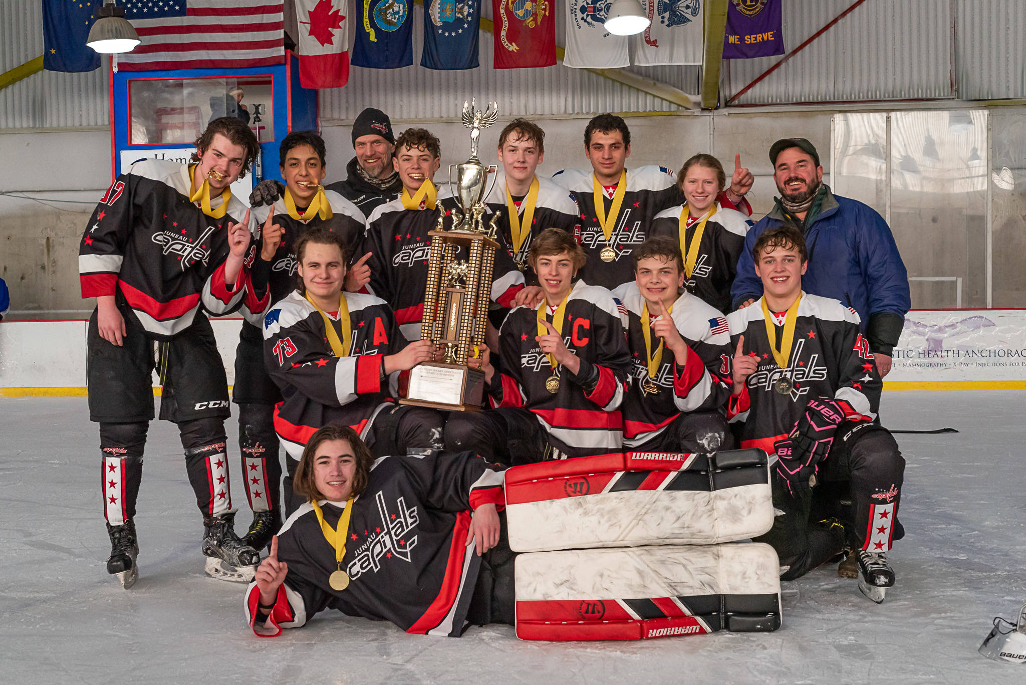 The Juneau Capitals claimed an 18-and-Under, Division A youth hockey title, grinding out four straight wins after opening the tournament with a tie. (Courtesy Photo / Mara Jennings)