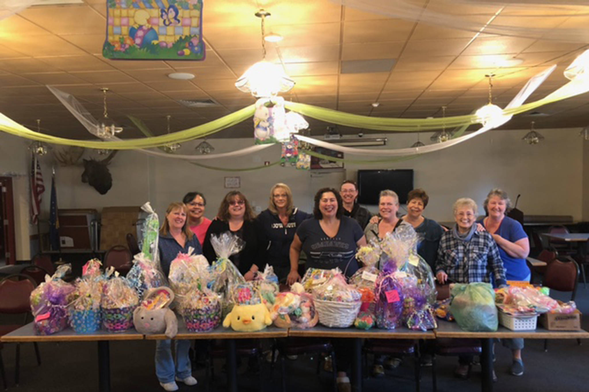 Women of the Moose volunteers pose with the Easter Baskets that they put together for all of the children at the AWARE shelter.  Each basket was made specific to each child’s age, said Jaime Isaak in an email. "A lot of happy children," Isaak said. (Courtesy Photo / Jaime Isaak)