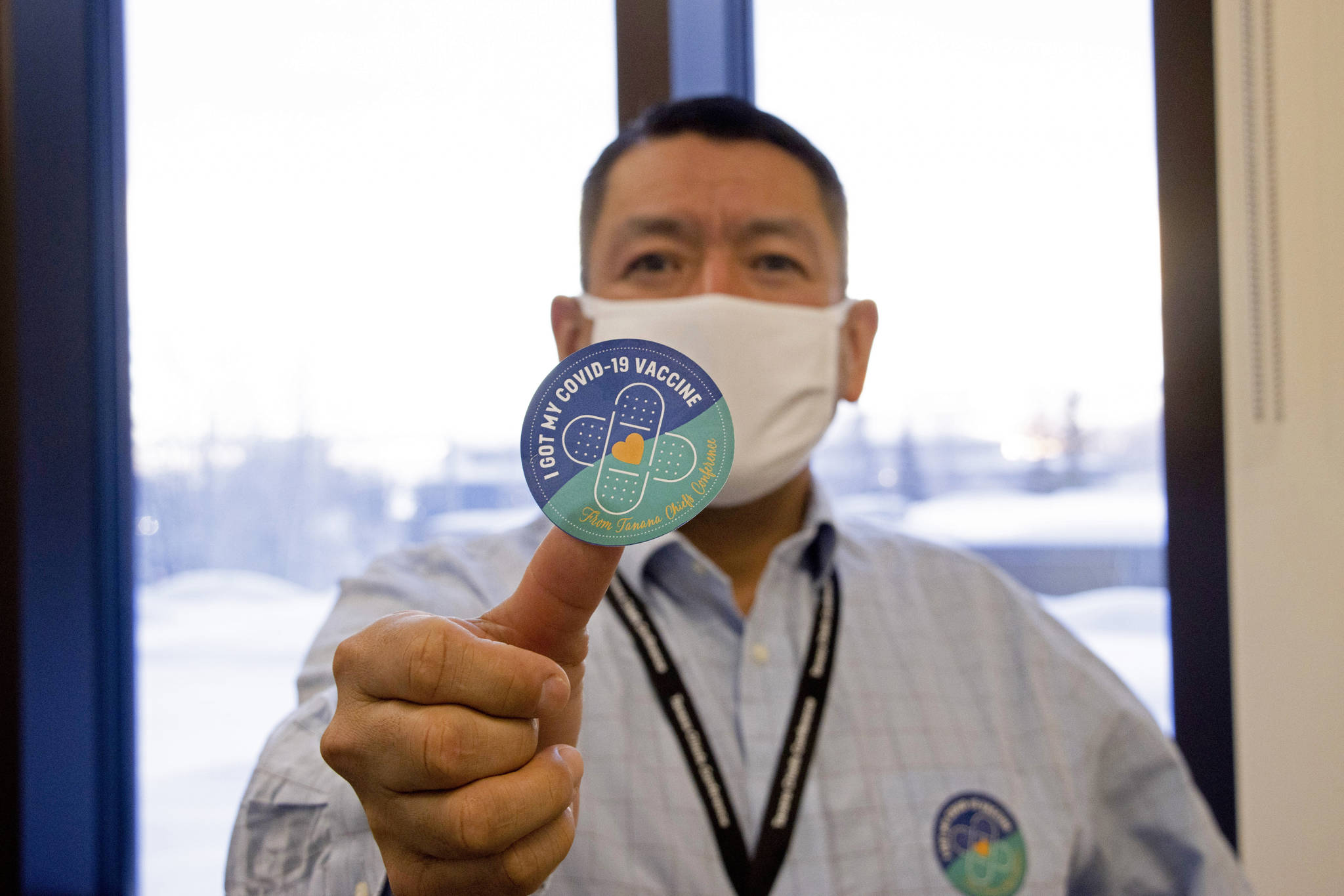 Rachel Saylor / Tanana Chiefs Conference 
In this undated photo provided by the, shows PJ Simon, chief and chairman of the Tanana Chiefs Conference in Fairbanks, Alaska, displays a COVID-19 vaccination sticker.