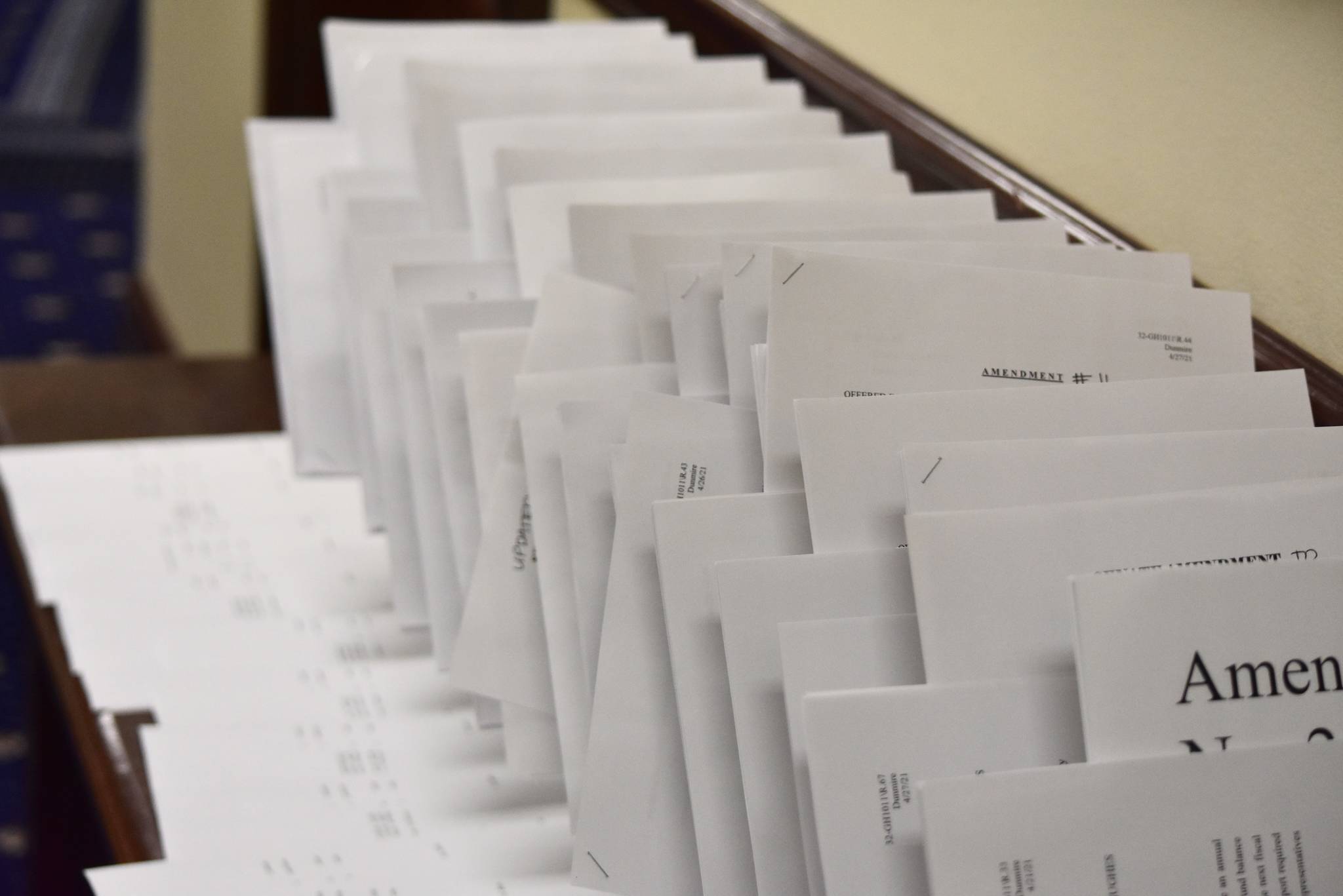 Dozens of amendments to a bill extending the state’s disaster declaration are laid out on a table outside the Senate chambers on Wednesday, April 28, 2021. Lawmakers eventually passed the bill, but didn’t adjourned until late in the evening. (Peter Segall / Juneau Empire.)