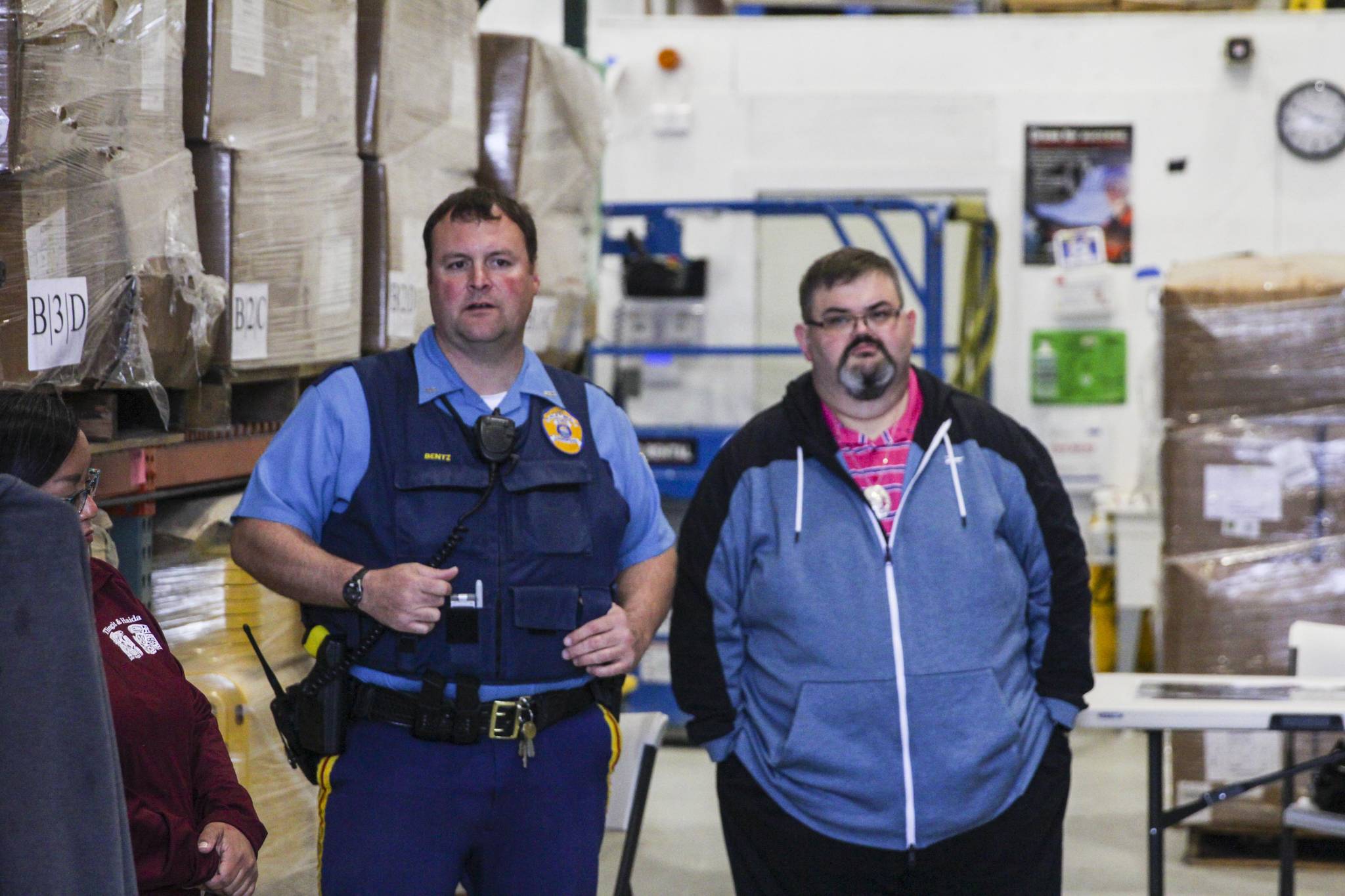 Alaska State Trooper Josh Bentz, left, addresses volunteers searching for a missing woman in Juneau before they set out on May 21, 2021. (Michael S. Lockett / Juneau Empire)