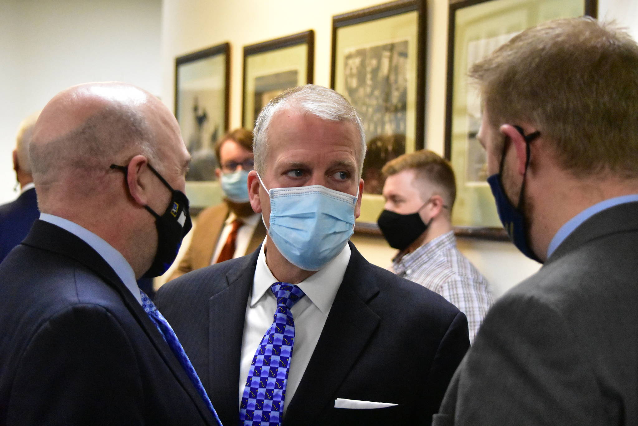 From left to right: Rep. Adam Wool, D-Fairbanks, U.S. Sen. Dan Sullivan, R-Alaska, and Alaska State Sen. Josh Revak, R-Anchorage, in the hallway of the Alaska State Capitol following Sullivan’s address to the Legislature. (Peter Segall / Juneau Empire File)