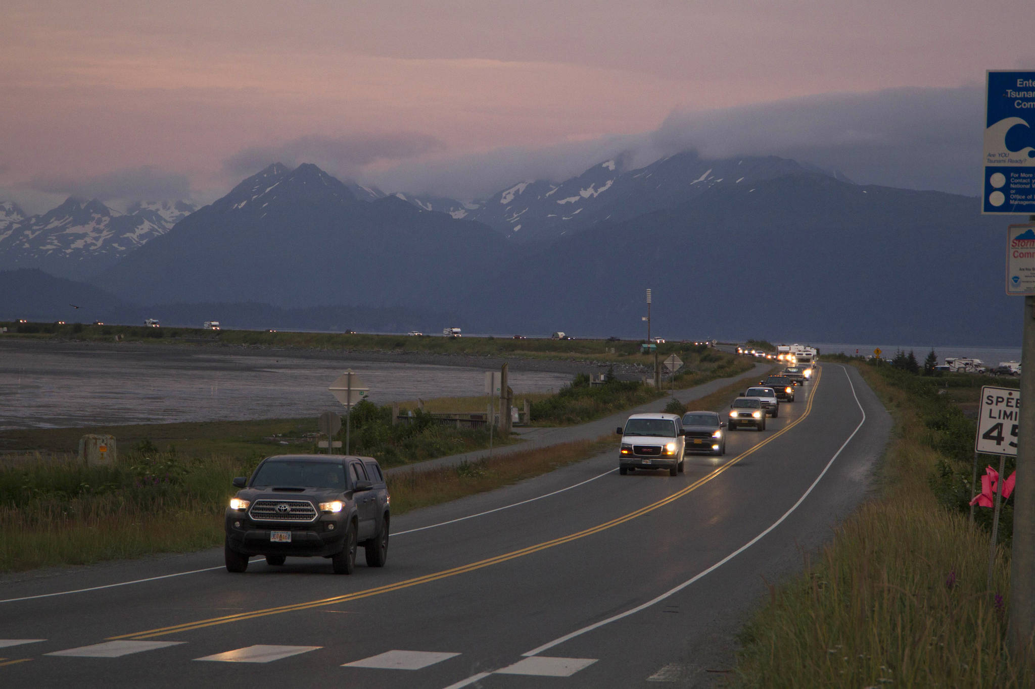 A line of cars evacuates the Homer Spit in Homer, Alaska on July 28, 2021, after a tsunami warning was issued following a magnitude 8.2 earthquake. The tsunami warning for much of Alaska’s southern coast was canceled when the biggest wave, of just over a half foot, was recorded in Old Harbor. Alaska. (Sarah Knapp / Homer News)