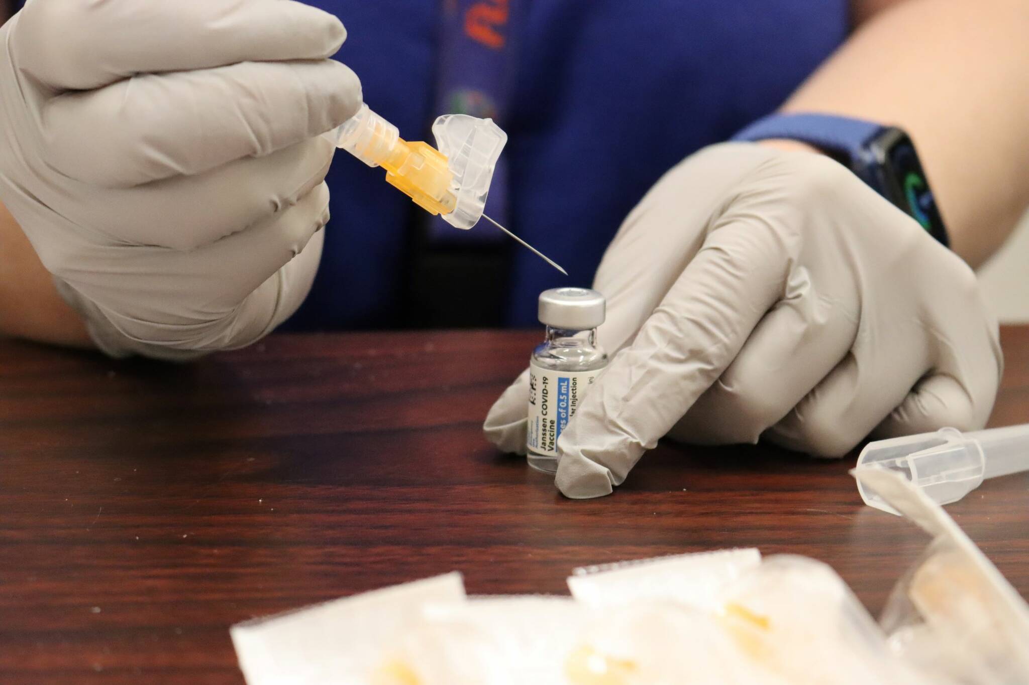 A health care worker prepares a dose of COVID-19 vaccine. There’s concern that COVID-19 vaccination could be made mandatory by businesses for activities such as travel— or employment. President Joe Biden is announcing sweeping new federal vaccine requirements affecting as many as 100 million Americans in an all-out effort to increase COVID-19 vaccinations and curb the surging delta variant. (Ben Hohenstatt / Juneau Empire File)