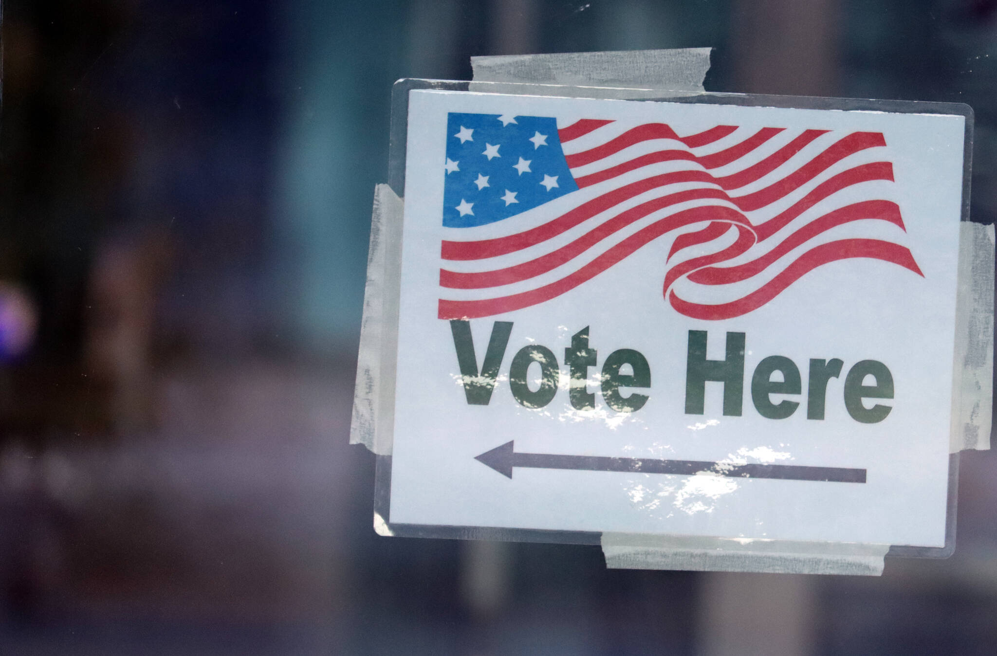 A sign designates a vote center at the Mendenhall Valley Public Library on Oct. 5, 2021. (Ben Hohenstatt / Juneau Empire)