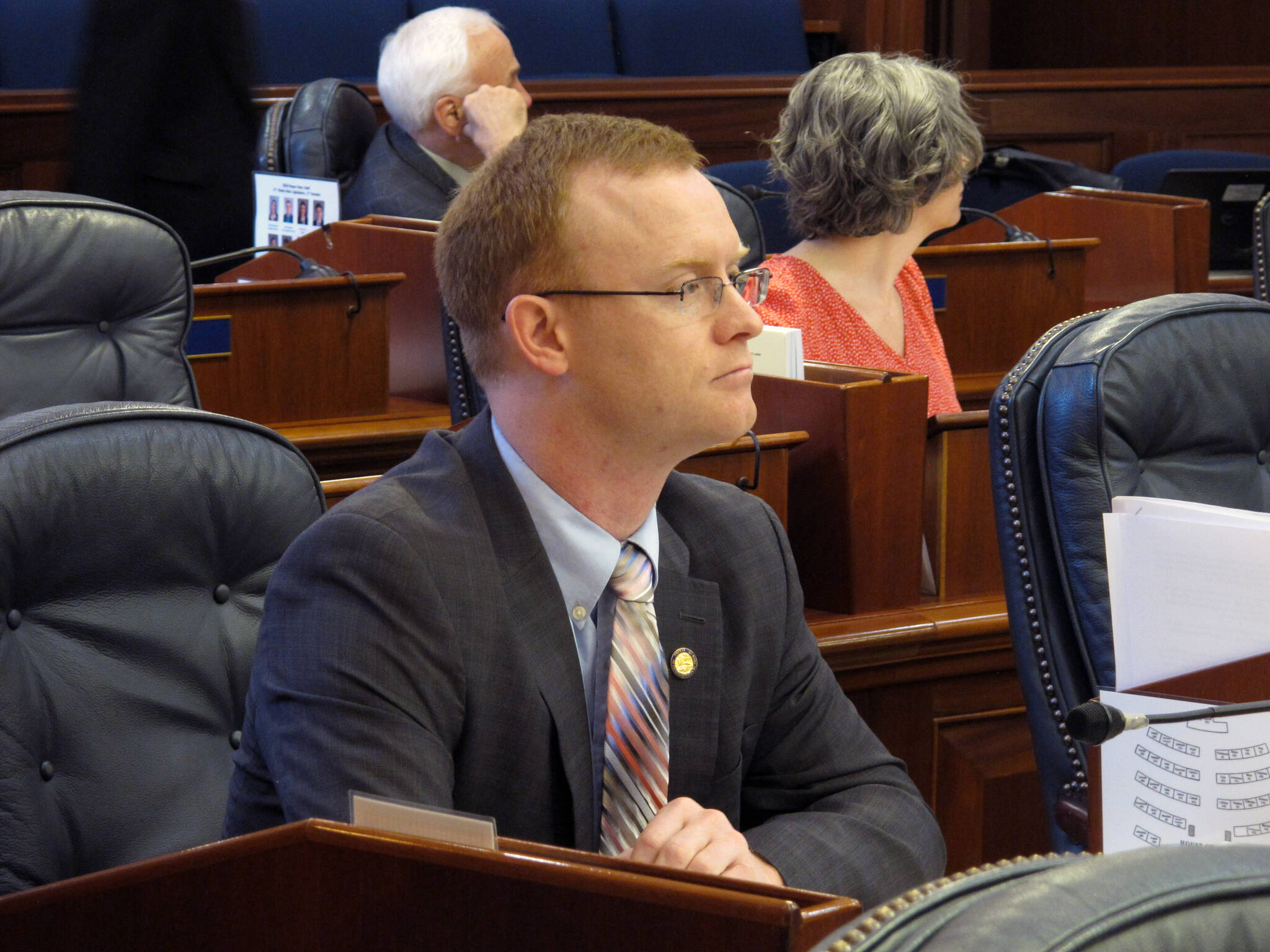 State Rep. David Eastman sits at his desk on the Alaska House floor in Juneau, Alaska, on March 5, 2020. Dozens of West Point graduates have demanded state Rep. Eastman resign from office over his ties to a right wing extremist group, saying his affiliation has betrayed the values of the U.S. Military Academy he attended. (AP Photo / Becky Bohrer)