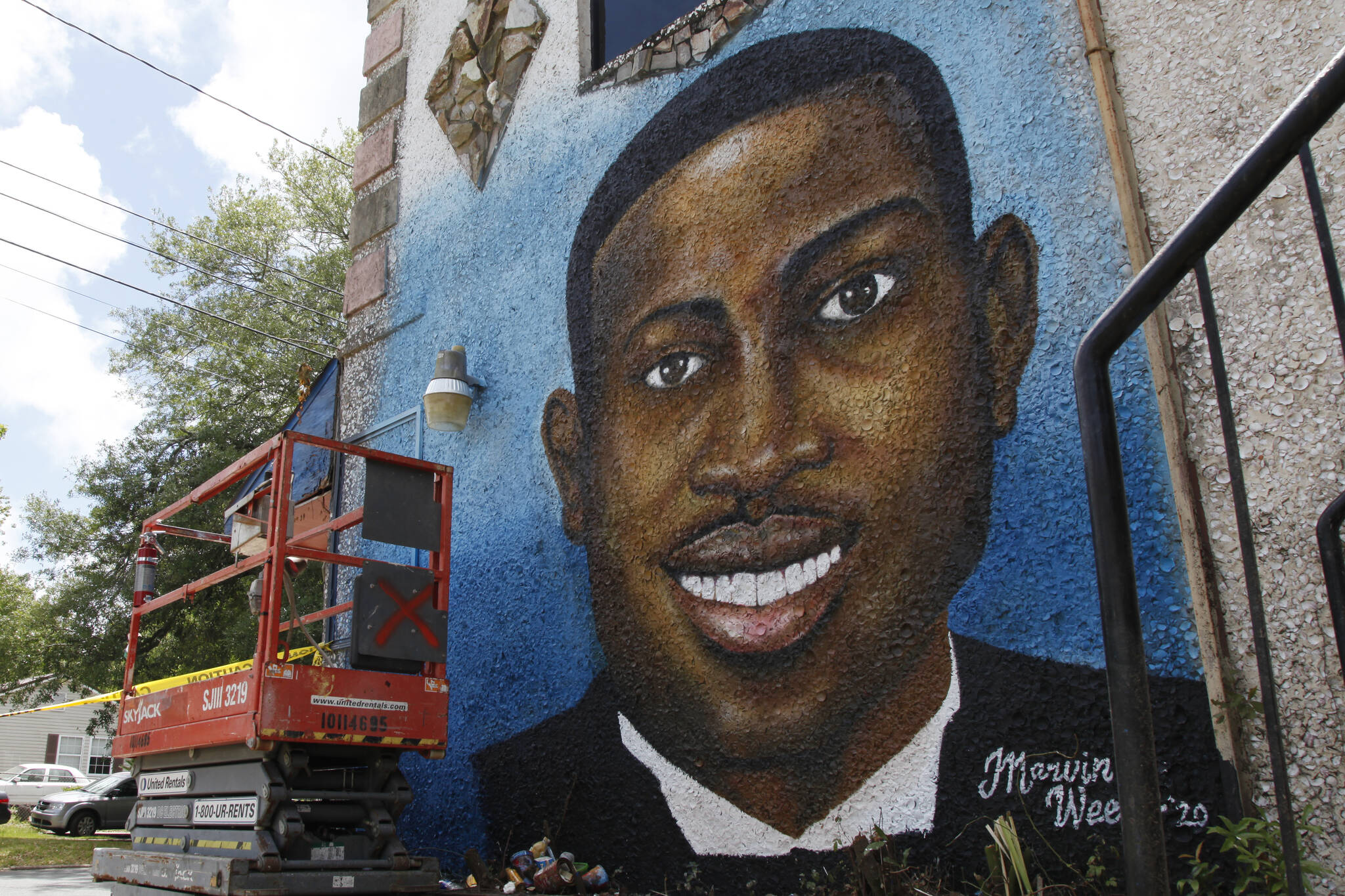 A painted mural of Ahmaud Arbery is displayed on May 17, 2020, in Brunswick, Ga., where the 25-year-old man was shot and killed in February.  Arbery was shot and killed by two men who told police they thought he was a burglar. (AP Photo / Sarah Blake Morgan)
