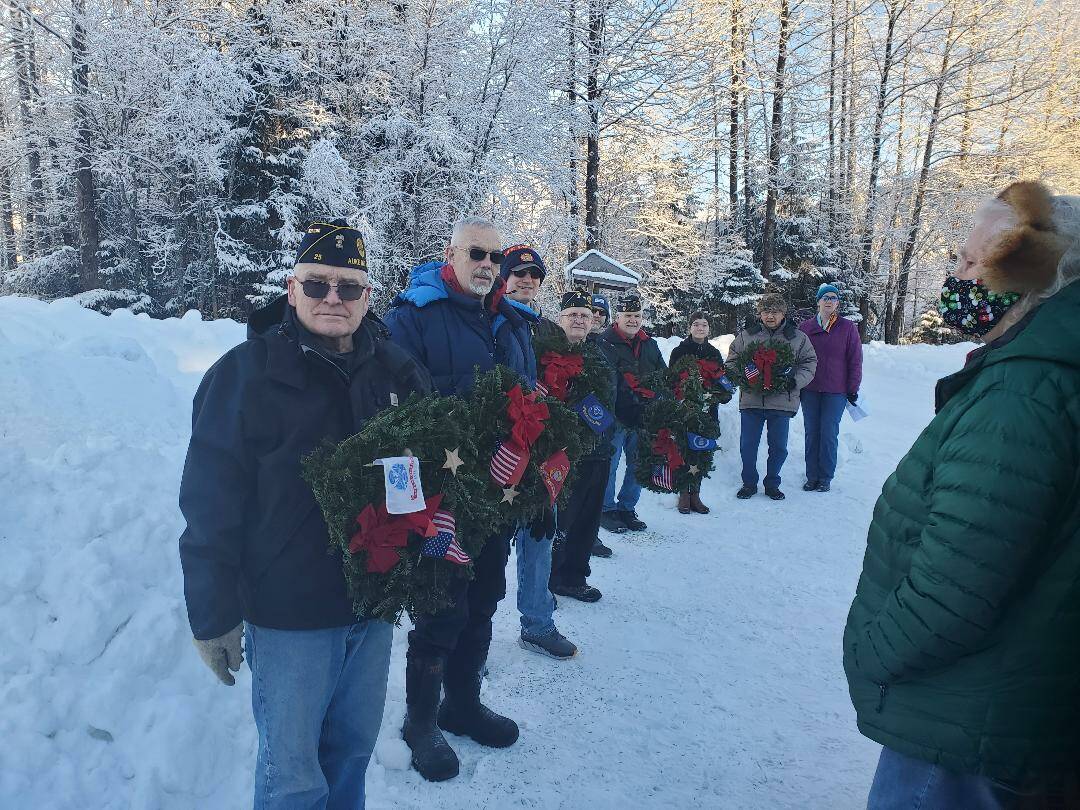 Members of the American Legion Post 25 prepare to lay wreaths at Alaska Memorial Park on Dec. 18, 2021. The group also laid wreaths at the Shrine of St. Therese and Evergreen Cemetery that day. (Courtesy photo / American Legion Post 25)