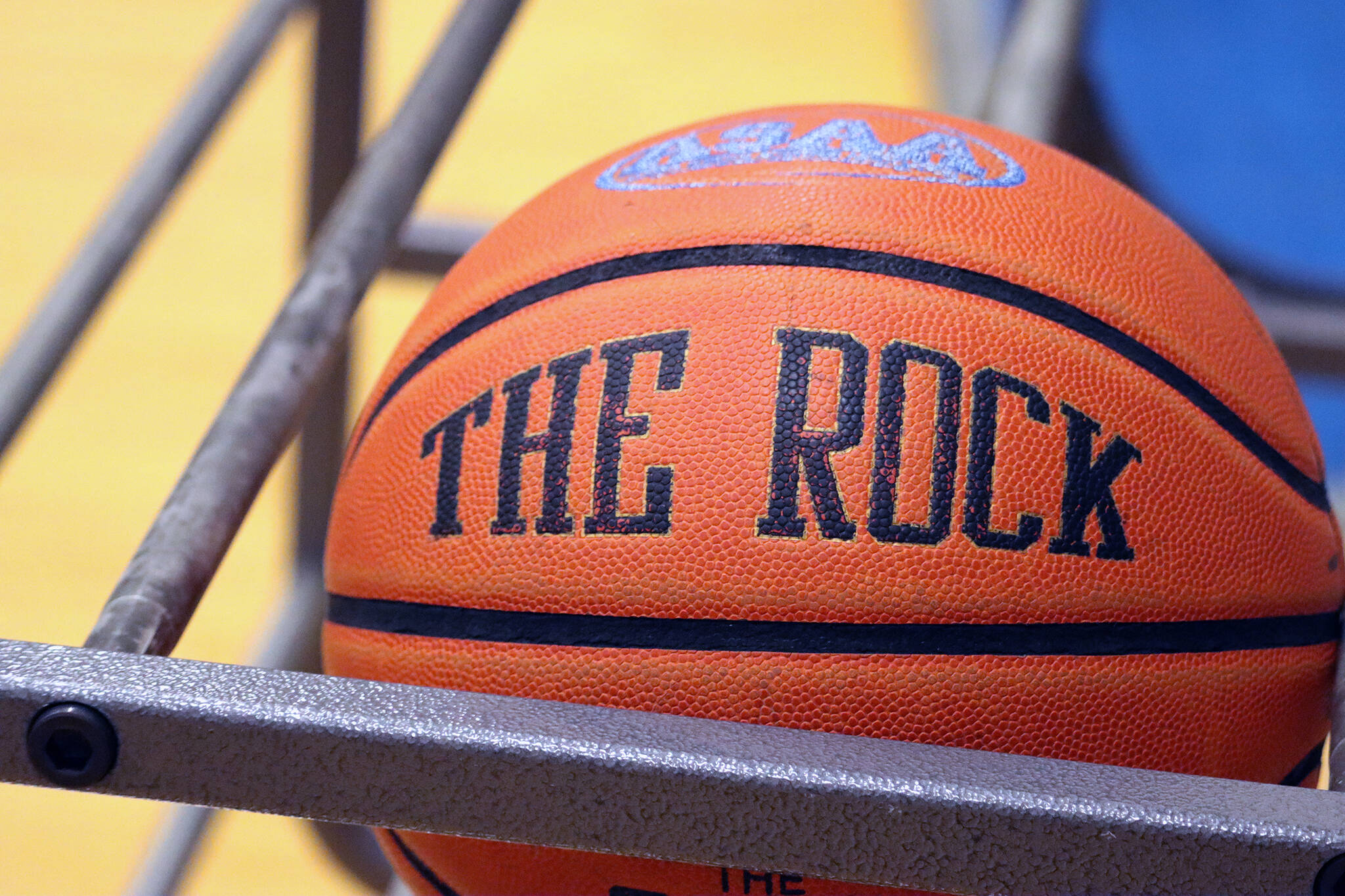 A basketball sits ready for play at Thunder Mountain High School on Dec. 7, 2021. Starting this week, Juneau's high school basketball and hockey players may participate in enhanced COVID-19 screenings rather than wear a mask while playing. (Ben Hohenstatt / Juneau Empire File)