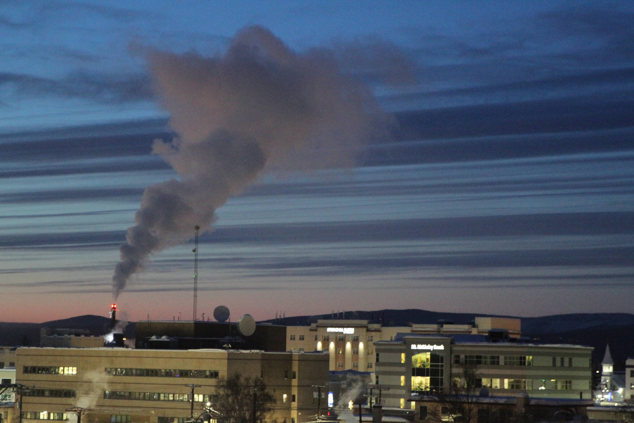 This Feb. 16, 2022, photo shows a plume of smoke being emitted into the air from a power plant in Fairbanks, which has some of the worst polluted winter air in the United States. Over seven weeks this winter, nearly 50 scientists from the continental U.S. and Europe descended on Fairbanks to study the sources of air pollution. (AP Photo / Mark Thiessen)