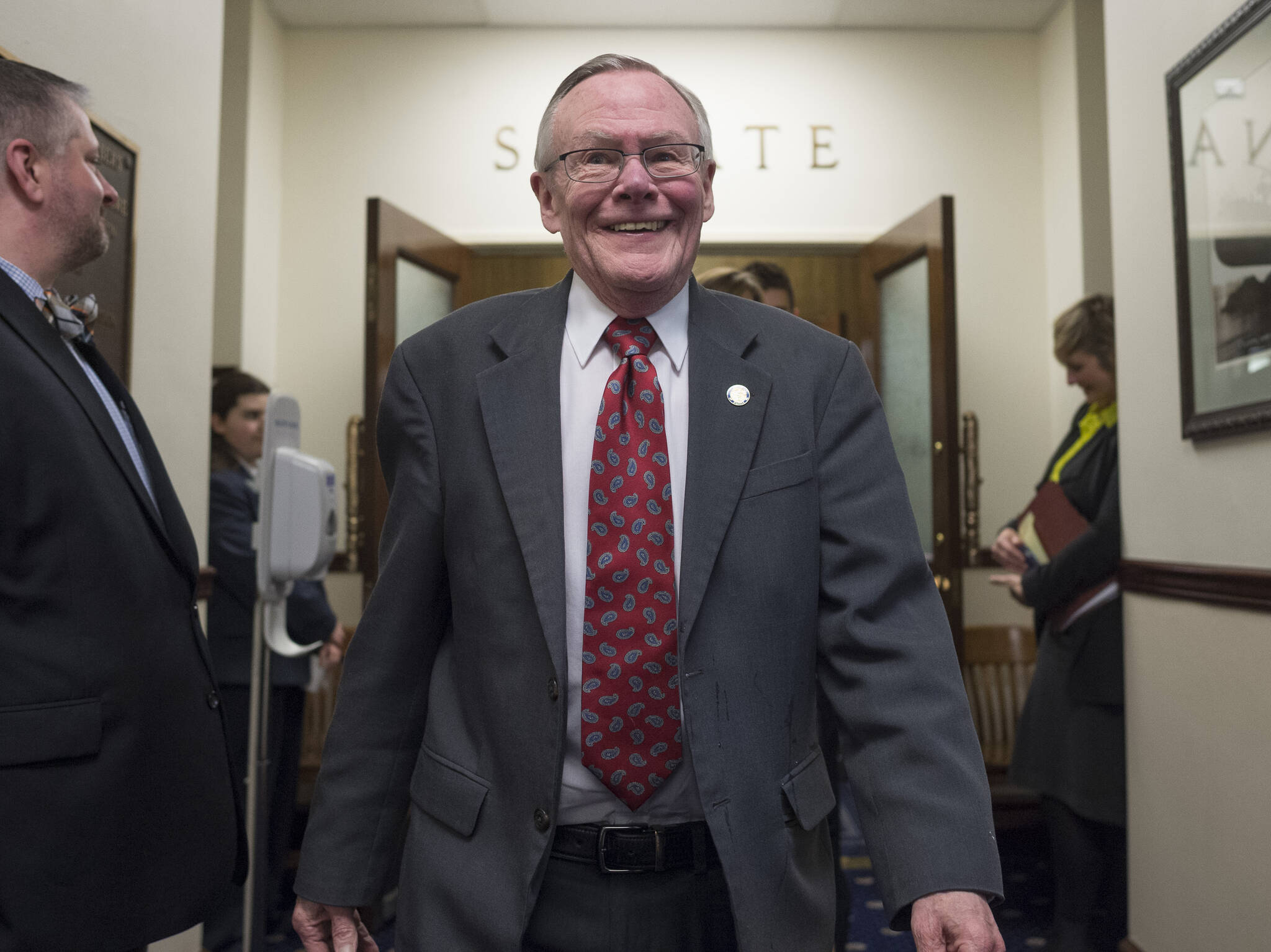 Michael Penn / Juneau Empire File 
In this April 11, 2018 photo state Sen. Dennis Egan, D-Juneau, walks out of the Senate chambers and to a reception to honor him and Sen. Berta Gardner, D-Anchorage, at the Capitol. Both were retiring from the legislature.