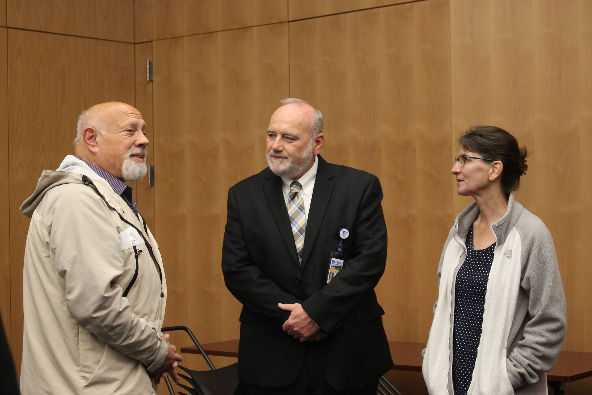 Bartlett Regional Hospital's CEO finalist Dennis Welsh (center) chats with community members and members of the BRH Board of Directors at his public meet and greet for the potential position. (Clarise Larson / Juneau Empire)