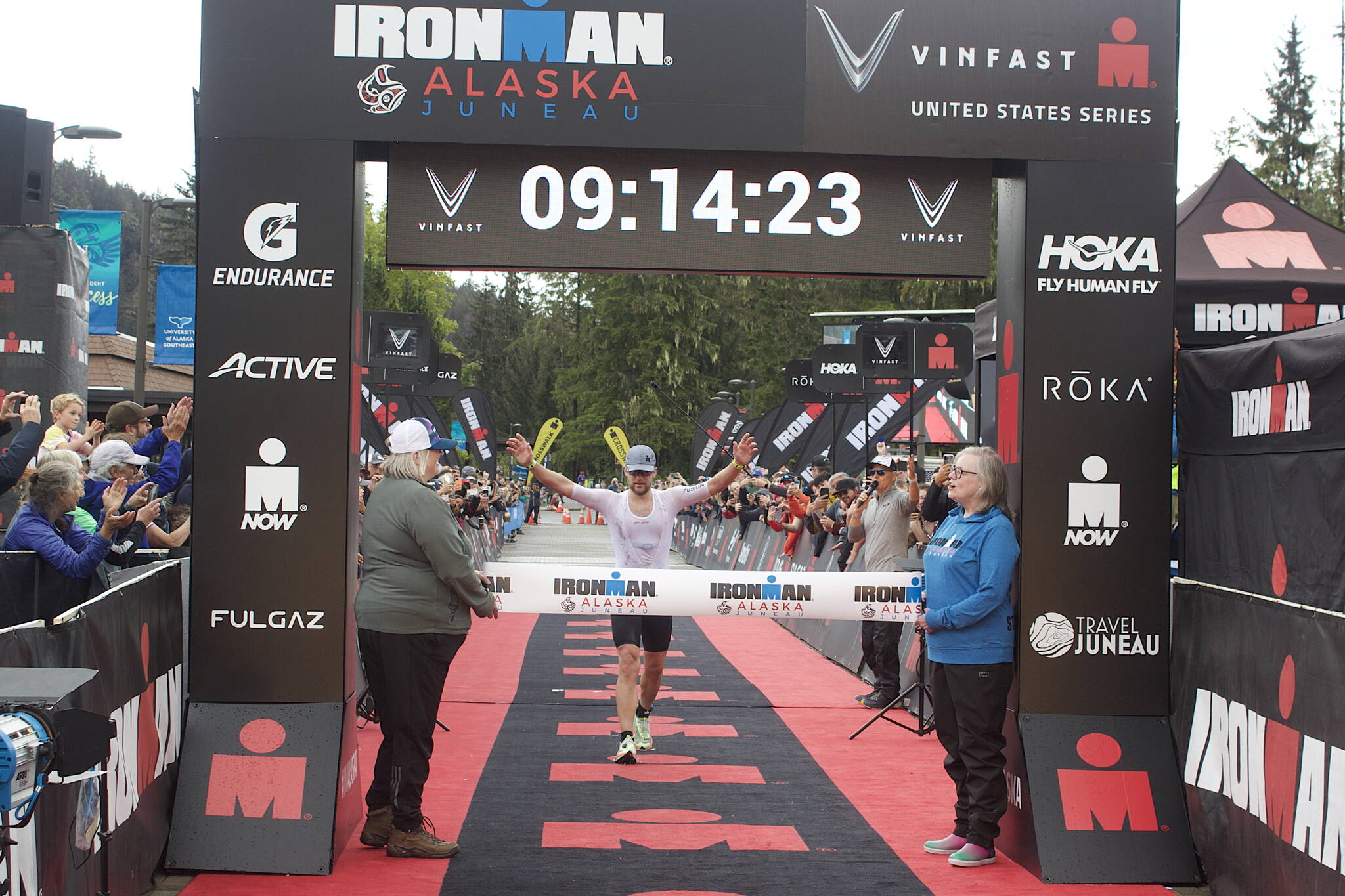 Alex Whetman, suffering leg cramps and numb hands moments after winning the inaugural Ironman Alaska on Sunday, found something sufficient to divert his attention a minute or so later while in the midst of explaining his victory to the surrounding cameras and voice recorders. Whetman, a Salt Lake City resident participating in his fifth Iron Man, finished with a time of 9 hours, 11 minutes and 17 seconds, more than 12 minutes ahead of the second-place finisher. (Mark Sabbatini / Juneau Empire)