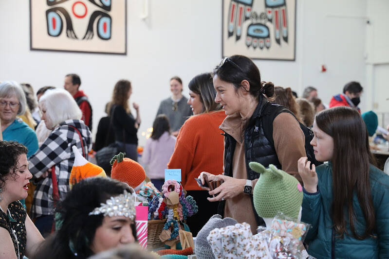 Residents made their way through the more than 30 local vendor booths included at the Juneau Arts & Culture Center for the first-ever Pumpkin Spice Market, a fall-themed festival hosted by the Juneau Arts and Humanities Council which celebrated local artists, businesses and organizations here in the capital city. (Clarise Larson / Juneau Empire)