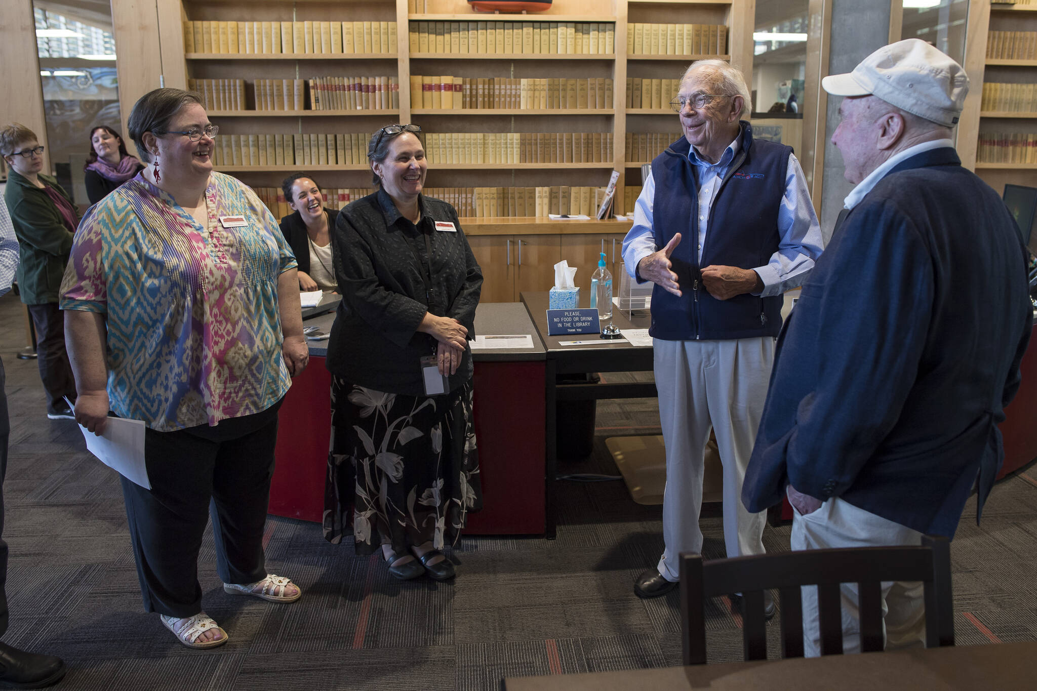The fifth Governor of Alaska, Bill Sheffield, second from right, speaks to Alaska State Archives staff during a visit to present a copy of his book, “Bill Sheffield: A Memoir, From the Great Depression to the Governor’s Mansion and Beyond” at the Father Andrew P. Kashevaroff Building in September 2018. Admiral Richard Knapp, right, who was Commissioner of Transportation during Gov. Sheffield’s administration, also attended the event. Sheffield died Friday at age 94. (Michael Penn / Juneau Empire File)