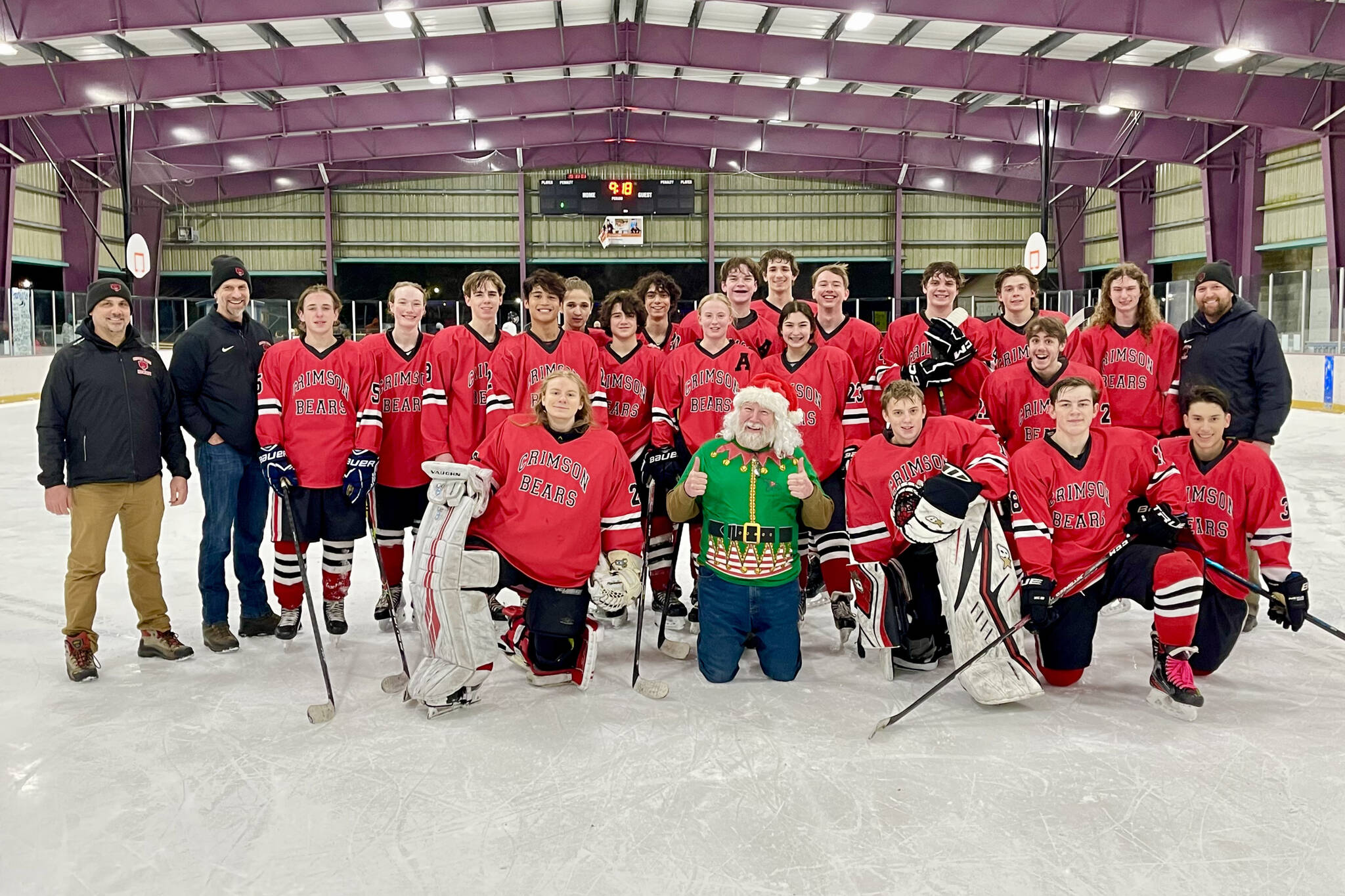 The Juneau-Douglas High School: Yadaa.at Kalé Crimson Bears Varsity hockey team poses with Santa after sleighing the competition during the team’s weekend stint in Kodiak. (Courtesy / Judy Campbell)
