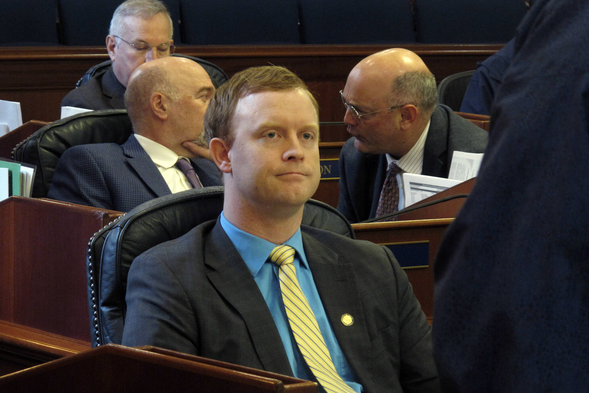 FILE - Alaska state Rep. David Eastman, R-Wasilla, sits in the House on April 29, 2022, in Juneau, Alaska. Eastman, accused of violating the state constitution's disloyalty clause over his lifetime membership in Oath Keepers, has not condemned the organization in the wake of the Jan. 6, 2021, insurrection at the U.S Capitol. "No, I generally don't condemn groups," Eastman, a Wasilla Republican, said during his bench hearing on Thursday, Dec. 15, 2022, his second day on the witness stand. (AP Photo / Becky Bohrer)