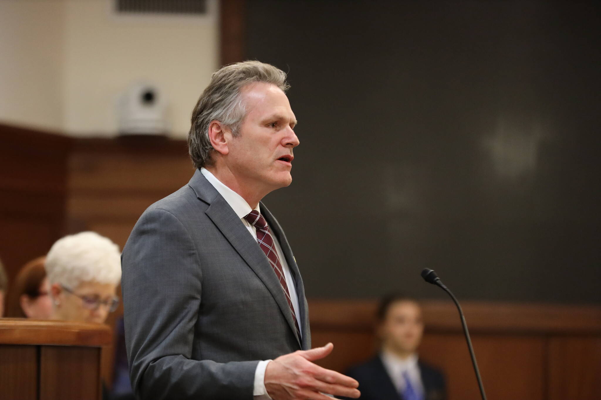 Gov. Mike Dunleavy addresses state lawmakers and guests attending his State of the State speech Monday night before a joint session of the Alaska State Legislature at the Alaska State Capitol. The 50-minute speech was praised by many legislators are more positive and less confrontational than his first address four years ago. (Clarise Larson / Juneau Empire)