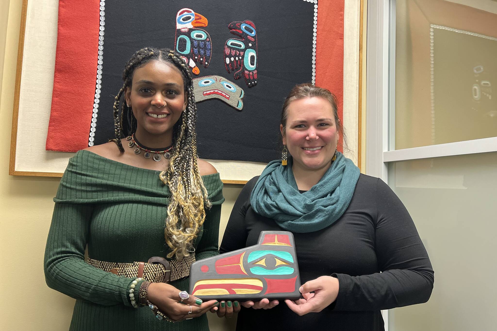 Alannah Johnson and Rebecca Kameika, winners of the 2022 Path to Prosperity Competition, pose for a photo at the formal winners’ announcement at the 2022 Mid-Session Summit at Southeast Conference Tuesday. In addition to each being awarded $25,000 to help expand their businesses, they each received a Tlingit wall carving, hand-crafted by Brian Chilton. (Jonson Kuhn / Juneau Empire)