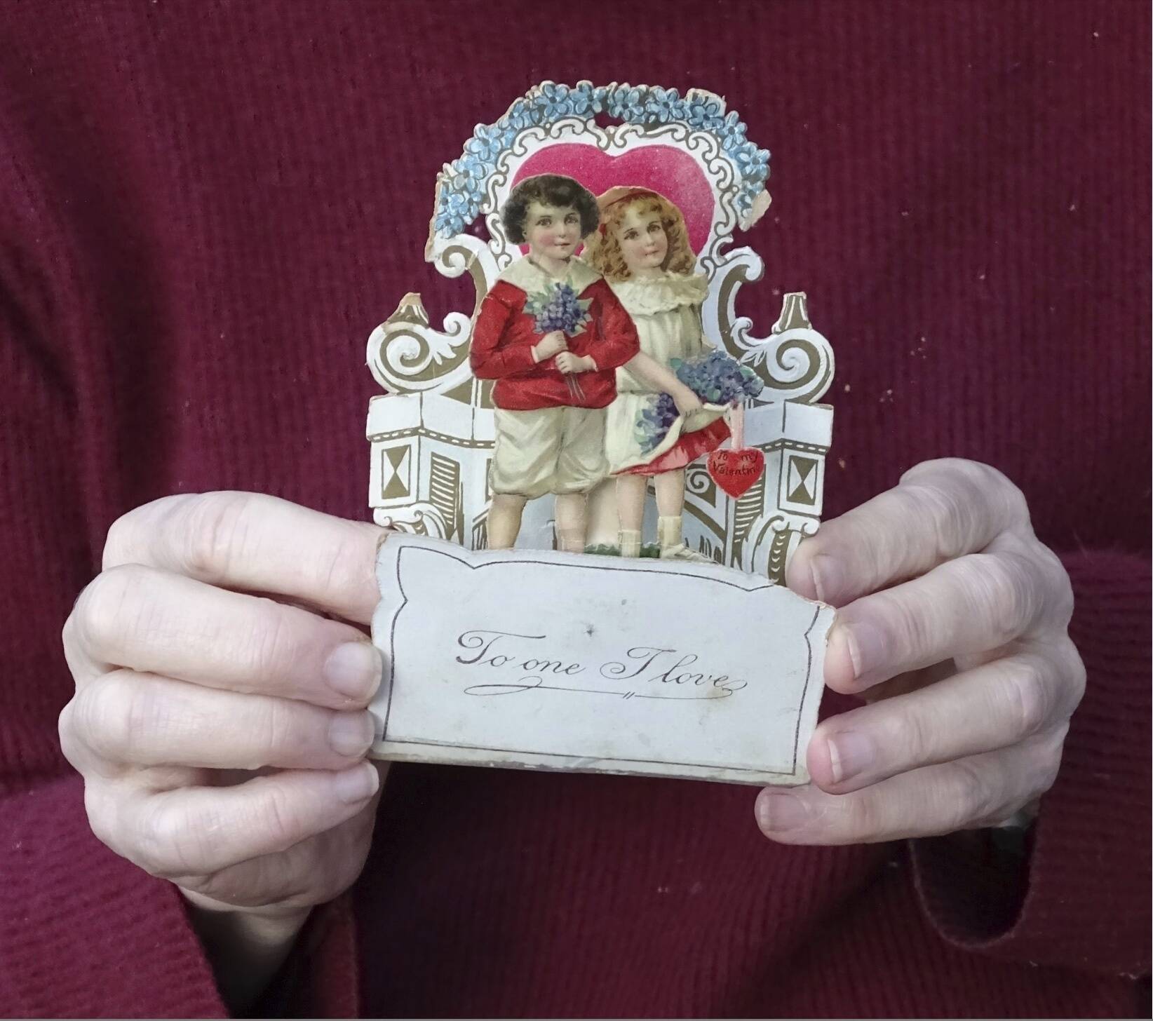 This image shows a Valentine’s Day card from 1917, given to Louise Wirt by Fred Roth when he was in the fourth grade. The couple married years later and the card remained near Louise’s bedside until her death at 91. (Nancy Roth via AP)