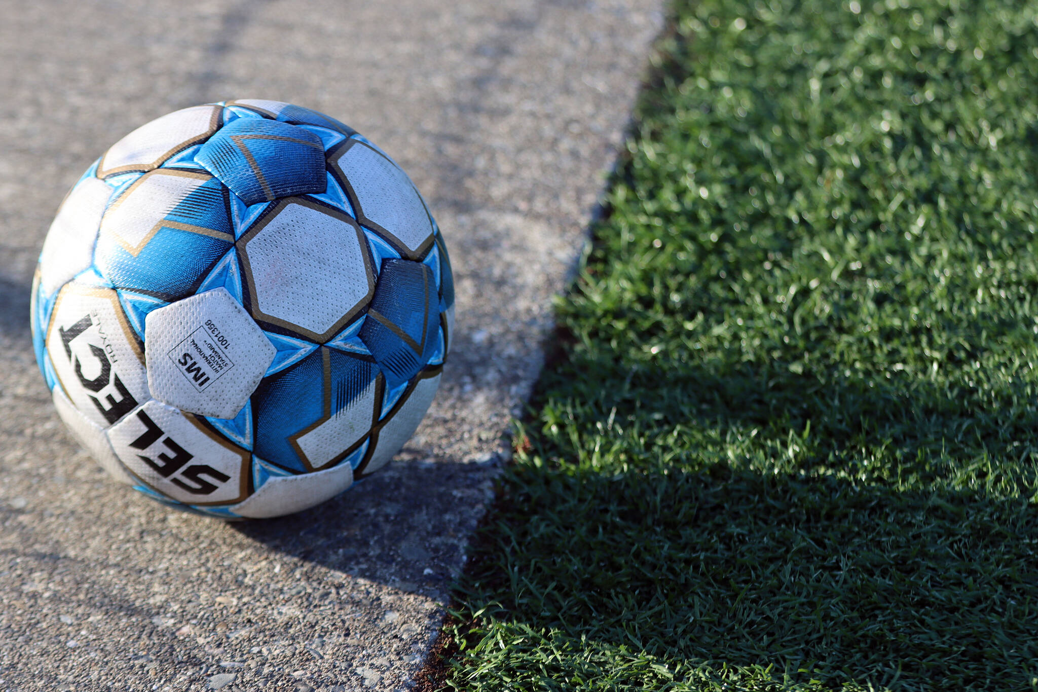 A soccer ball rests on the field at Thunder Mountain High School. The JDHS girls bested TMHS 9-0 on Wednesday behind five goals from Peyton Wheeler. (Ben Hohenstatt / Juneau Empire)