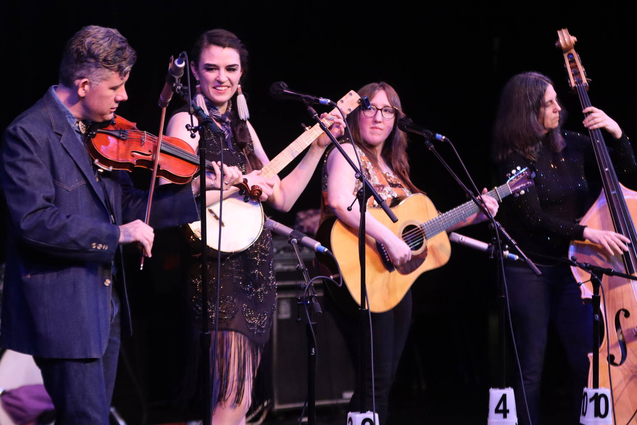 Folkapotamus featuring Andrew Heist, Annie Bartholomew, Erin Heist and Nicole Lantz play to a pack house Saturday night at JDHS for the 48th annual Alaska Folk Festival. (Jonson Kuhn / Juneau Empire)