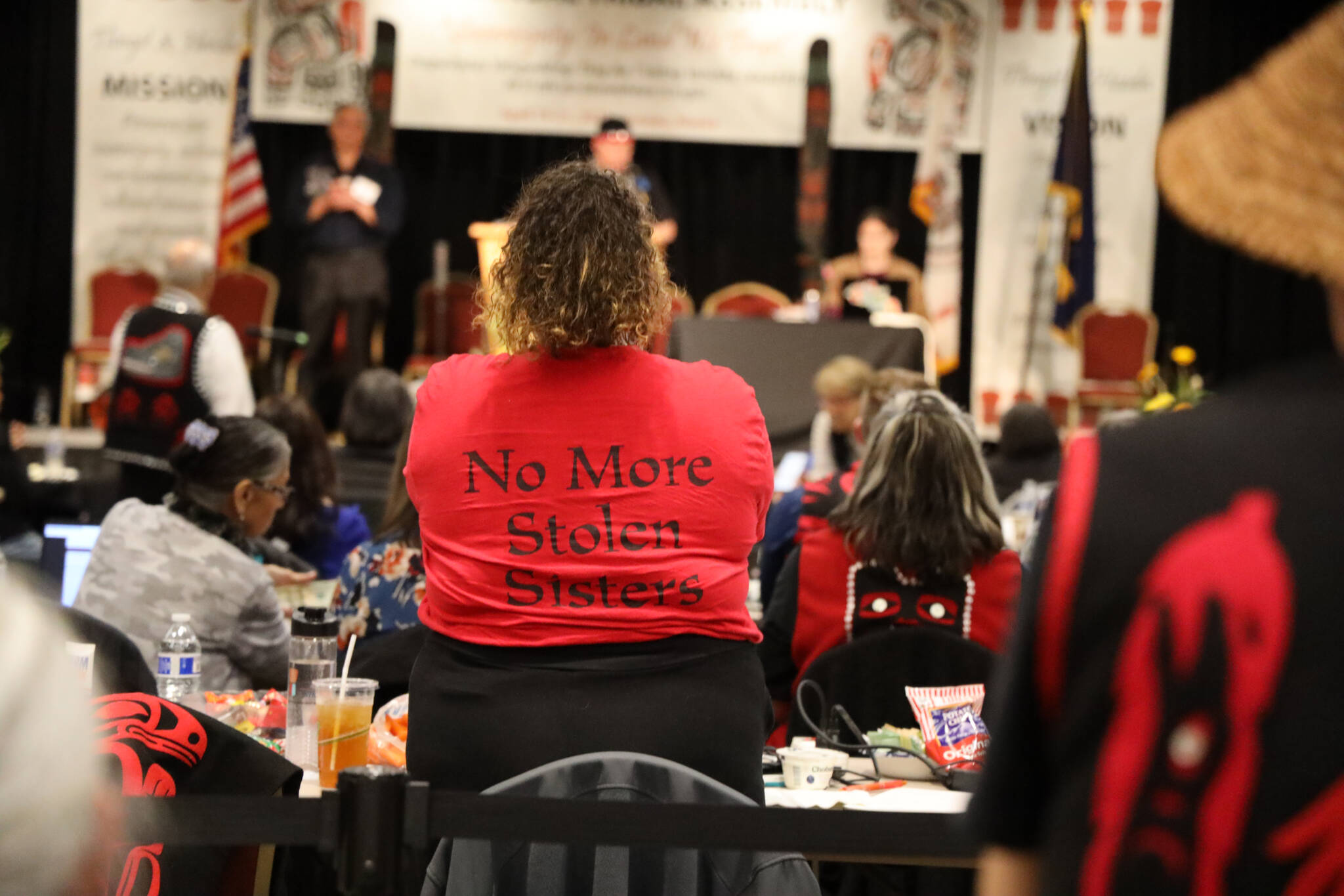 Lax̲áakúda.oo Jessica Elopre, a Seattle delegate of the Assembly, wears a shirt in reference to missing and murdered Indigenous women during the 88th Tribal Assembly of the Central Council of the Tlingit and Haida Indian Tribes of Alaska. On Friday a resolution to commission a totem pole in Juneau that is dedicated to missing and murdered Indigenous women passed unanimously. (Clarise Larson / Juneau Empire)