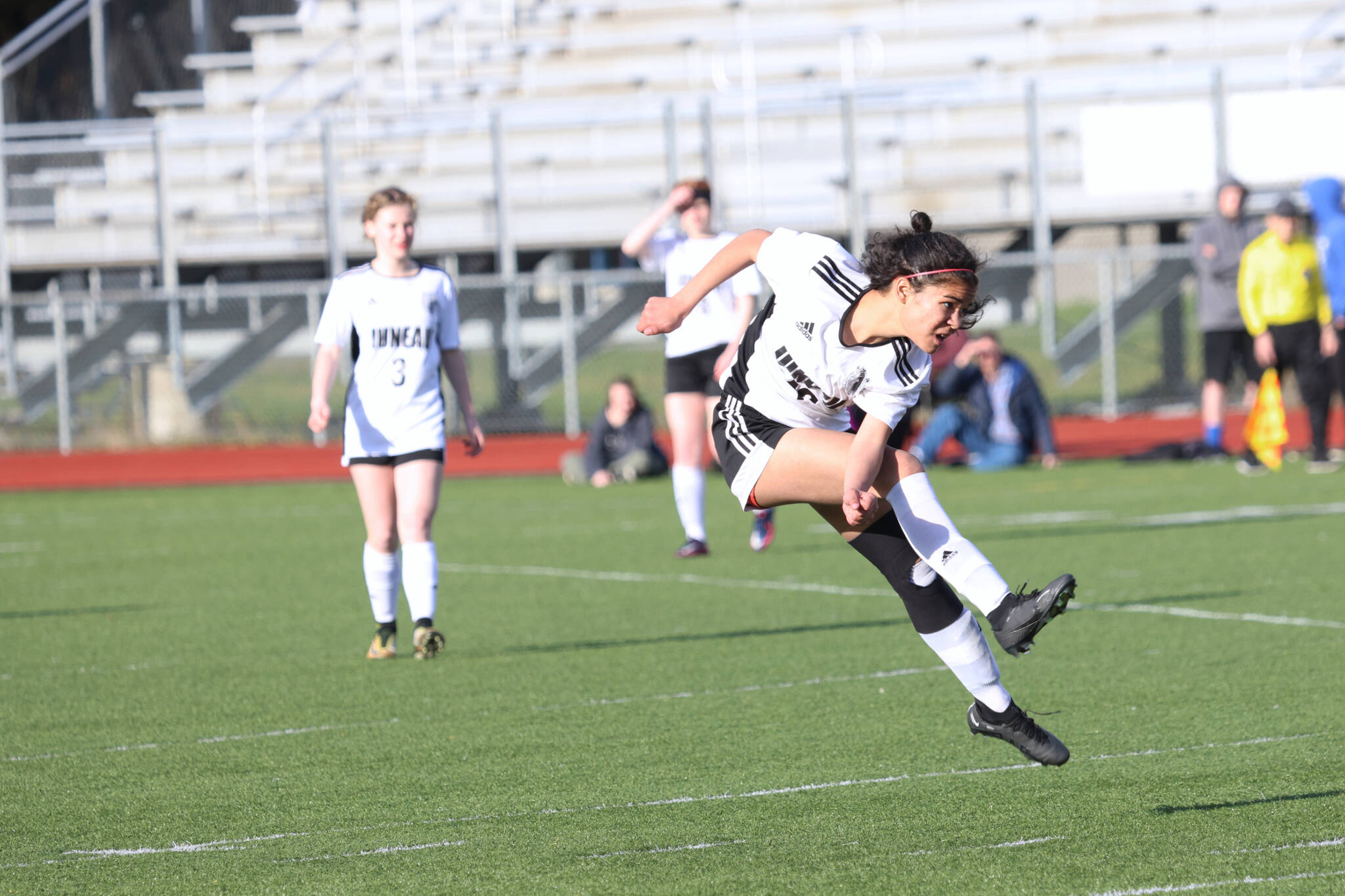 Juneau-Douglas High School: Yadaa.at Kalé junior Cadence Plummer (12) follows through on a goal-scoring kick in the second half of a win against Thunder Mountain High School at TMHS. (Ben Hohenstatt / Juneau Empire)