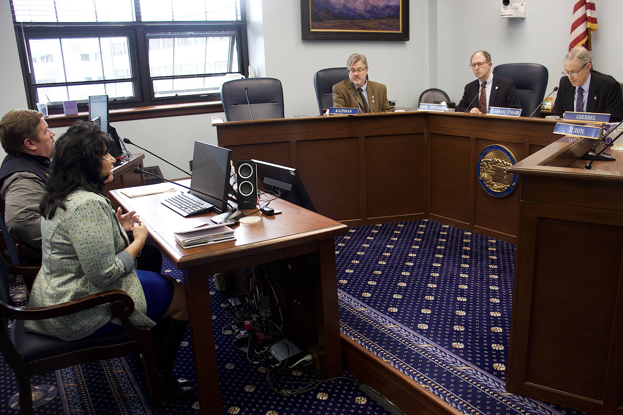 State House Speaker Cathy Tilton, R-Wasilla, left, offers her opinion during a Senate Judiciary Committee meeting Sunday about changes the committee made to a bill she’s sponsoring that would prevent state and municipal officials from closing stores that sell firearms during disaster declarations. The committee, which watered down some aspects of the original version, advanced the bill to a potential floor vote after a 50-minute hearing that featured heated public testimony both for and against the proposal. At right, state Sen. Matt Claman, D-Anchorage, presiding over the meeting as chair of the committee, denied the sudden hearing scheduled with less than a day’s notice is related to efforts to advance a bill of his that’s stalled in a House committee. (Mark Sabbatini / Juneau Empire)