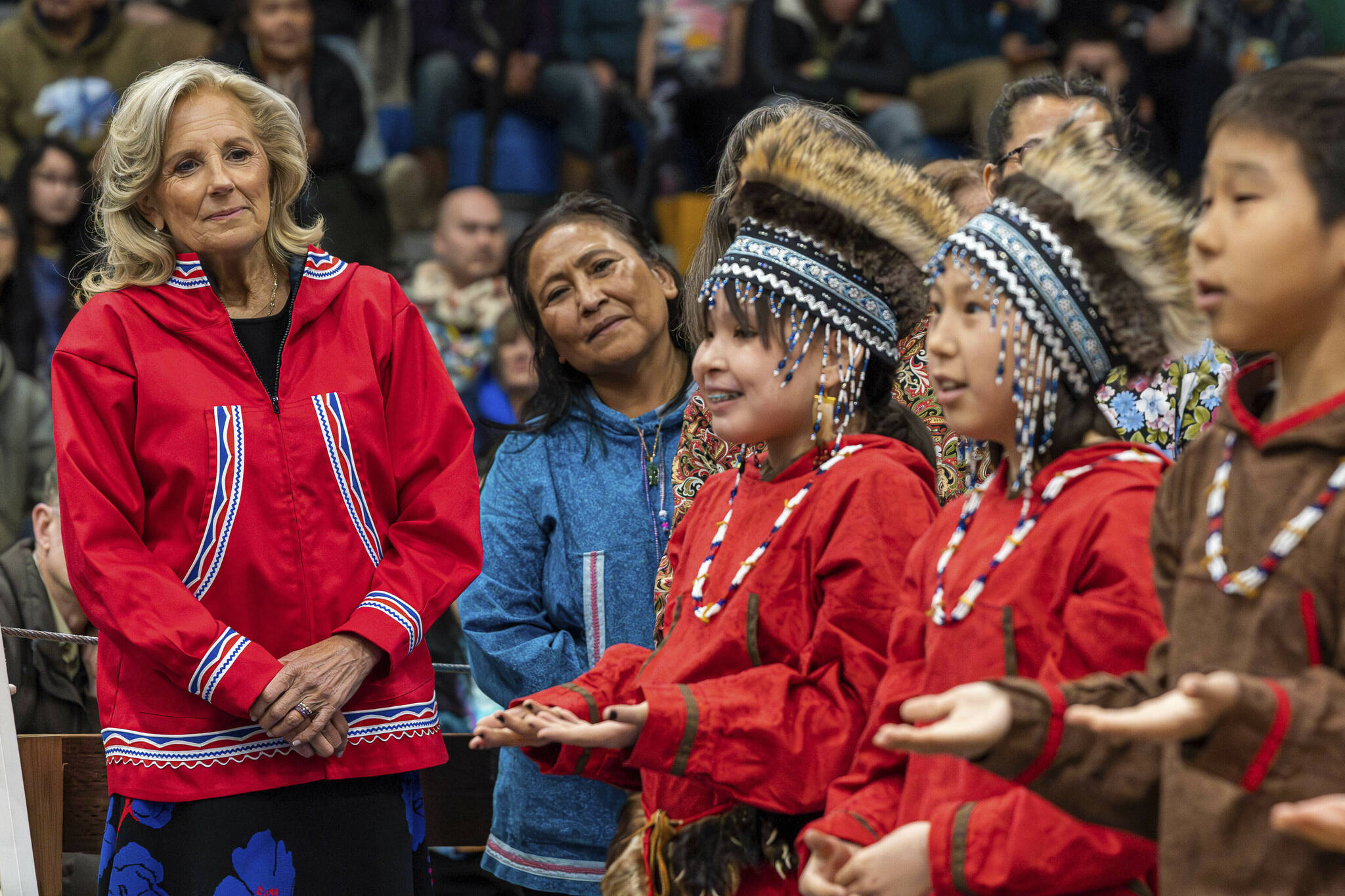 U.S. first lady Jill Biden, left, and first lady of Alaska Rose Dunleavy watch a performance by Ayaprun Elitnaurvik students during an event at Bethel Regional High School in Bethel, Alaska on Wednesday, May 17, 2023. Ayaprun Elitnaurvik is a Yugtun immersion school in Bethel. Biden and Interior Secretary Deb Haaland traveled to Bethel to highlight the Biden-Harris administration's investments to expand broadband internet connectivity in Native American communities, including Alaska's Yukon-Kuskokwim Delta. (Loren Holmes/Anchorage Daily News via AP)