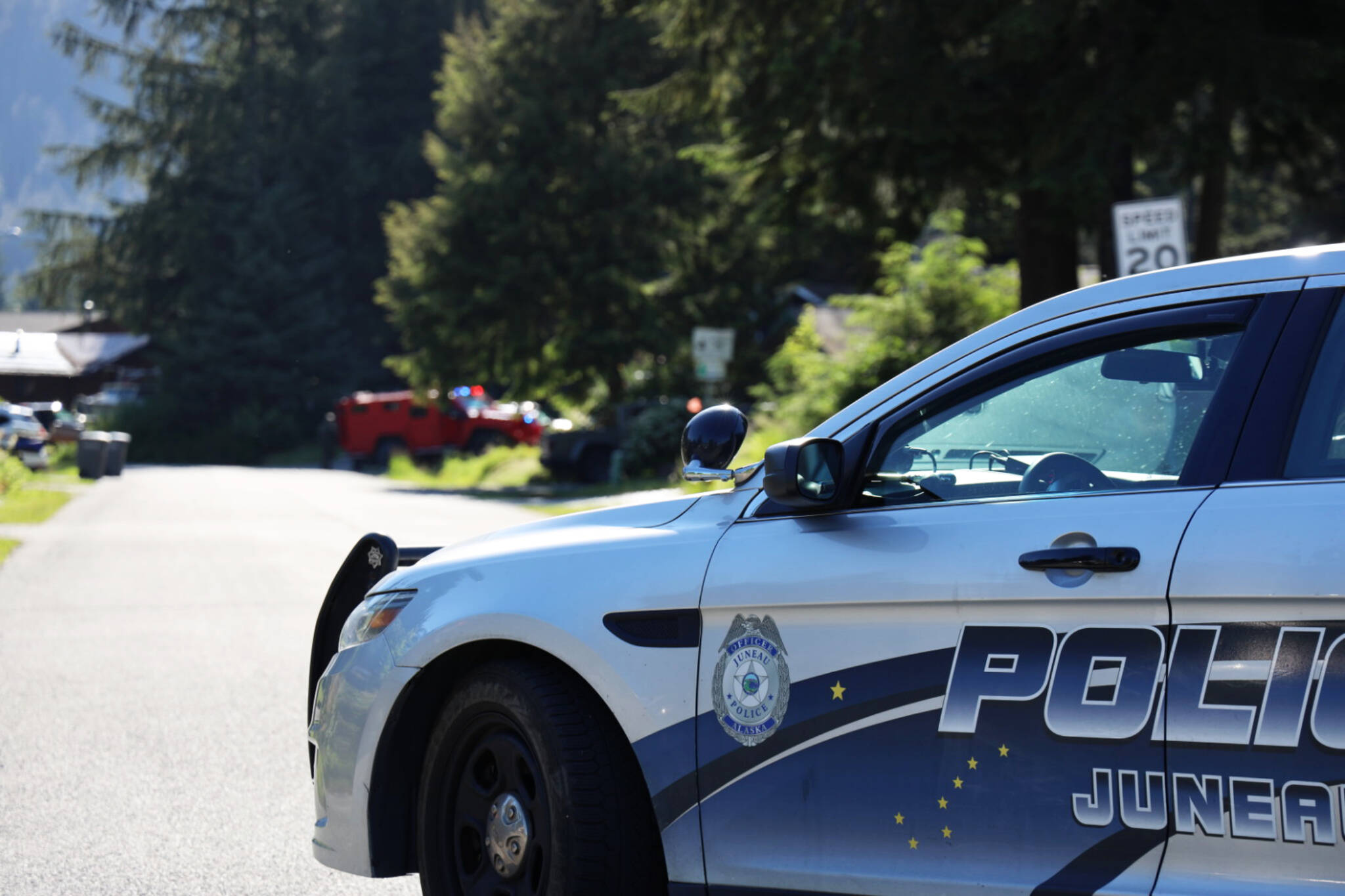 A police car parks near a residence on Riverwood Drive on Friday where Andre P. Lawrence was detained by police officers in connection with the fatal shooting of a 23-year-old man on Cinema Drive on Thursday evening. (Clarise Larson / Juneau Empire)