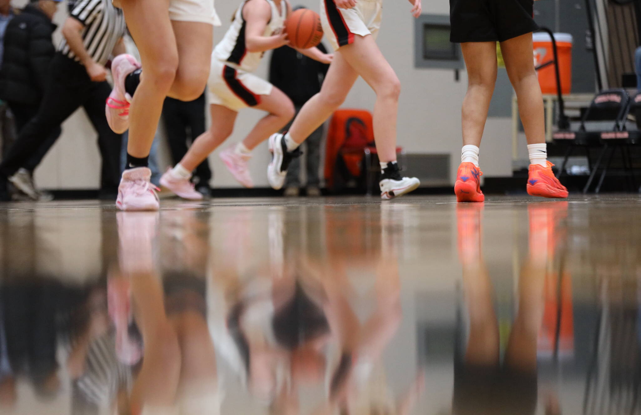 Basketball players face off at Juneau-Douglas High School: Yadaa.at for a basketball game in December 2022. (Clarise Larson / Juneau Empire File)