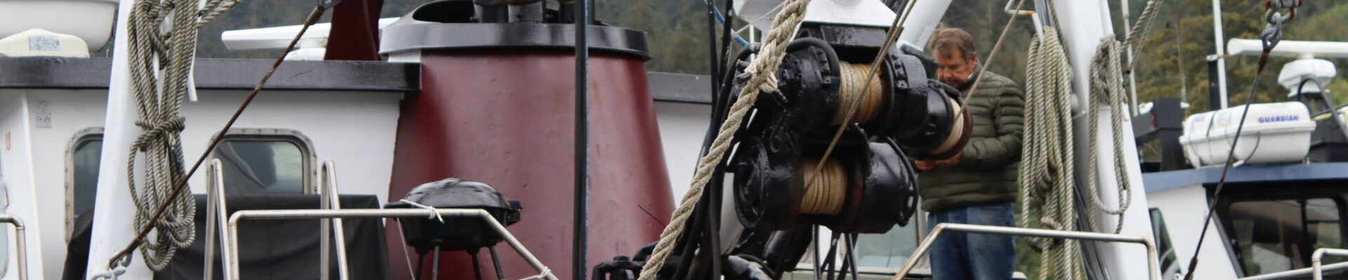 Norval Nelson, owner and operator of Star of the Sea, and his wife, Barbara Cadiente, clean and prep the boat in Aurora Harbor on Wednesday, the same day the Alaska Department of Fish and Game announced commercial crab fisheries would remain closed again this year. (Meredith Jordan/Juneau Empire)