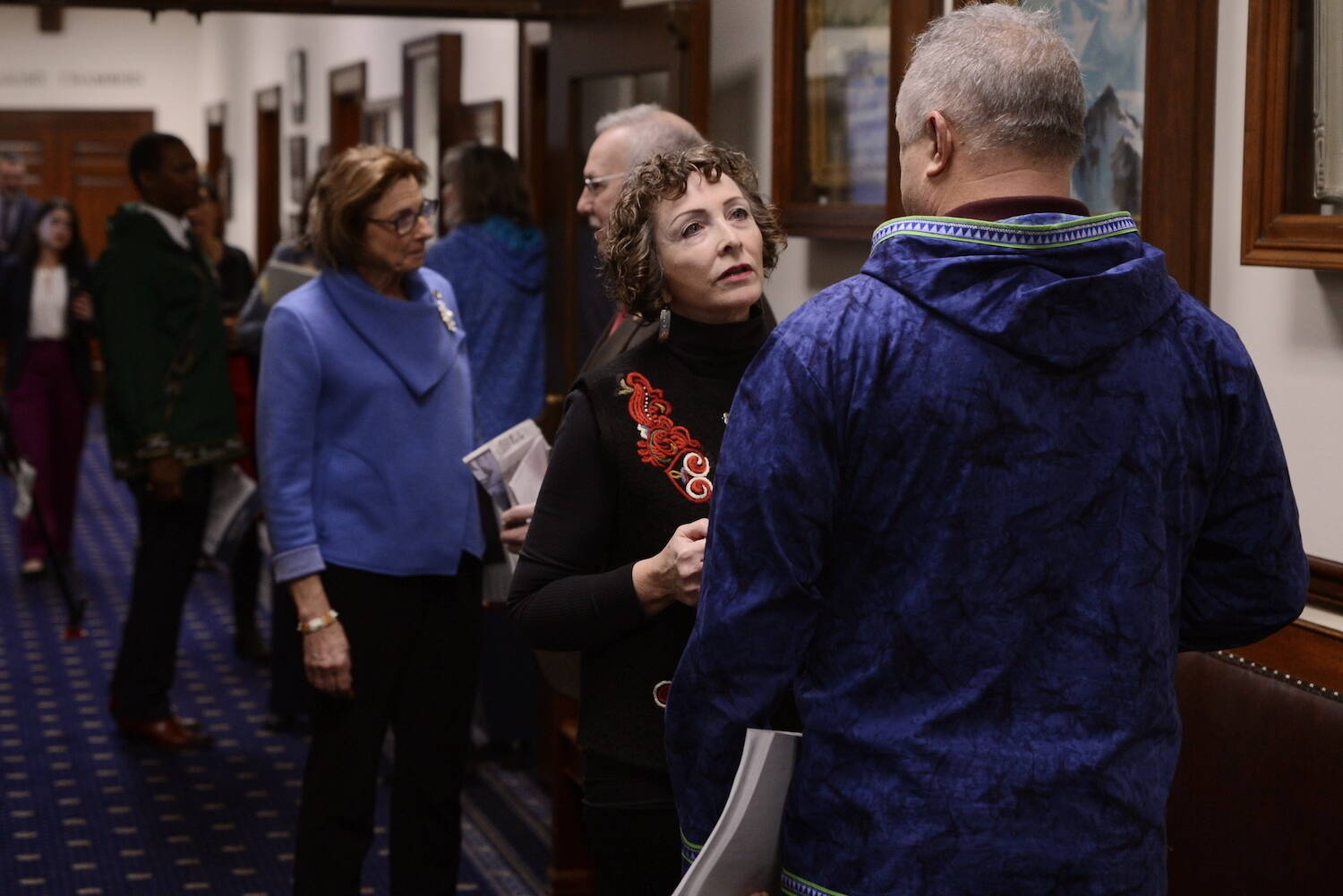 Sen. Shelley Hughes, R-Palmer, speaks to Sen. Mike Shower, R-Wasilla, on Friday, Jan. 26, 2024. (Photo by James Brooks/Alaska Beacon)