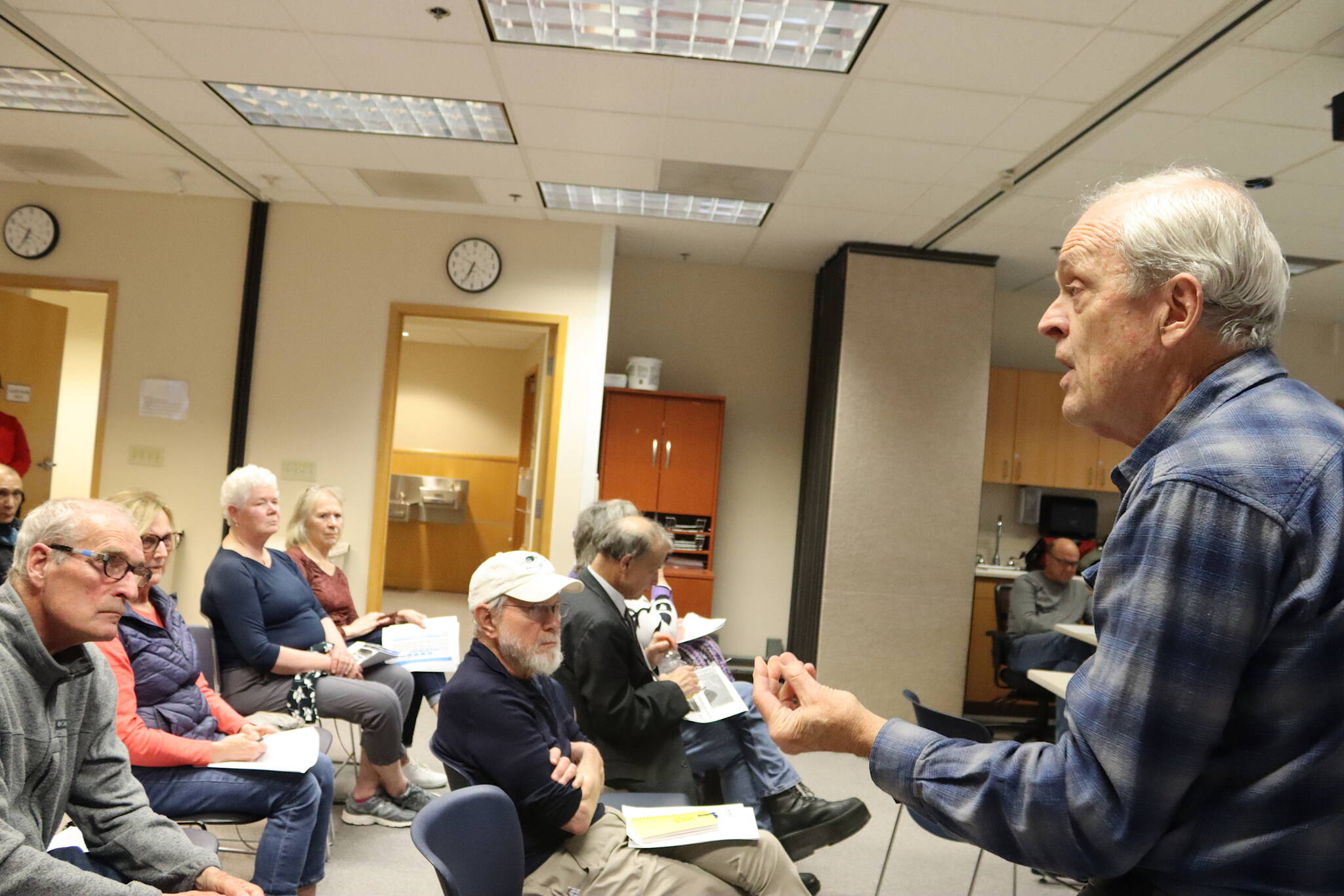 Quigley Peterson, a longtime doctor at Bartlett Regional Hospital, speaks in favor of its hospice and home health programs during a public forum at the hospital Tuesday to get feedback on proposed cuts to certain programs. (Mark Sabbatini / Juneau Empire)